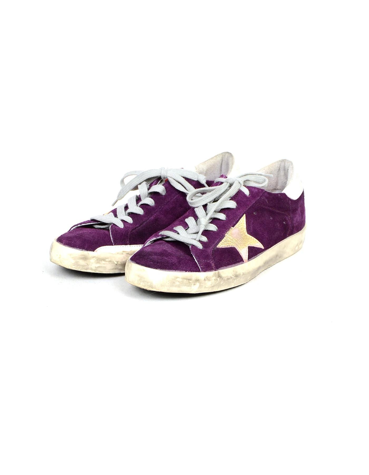 Golden Goose Purple/Gold Suede Low-Top Superstar Sneakers Sz 40

Made In: Italy
Color: Purple, gold, grey 
Materials: Suede, rubber, leather
Closure/Opening: Lace up front 
Overall Condition: Very good pre-owned condition, wear throughout is