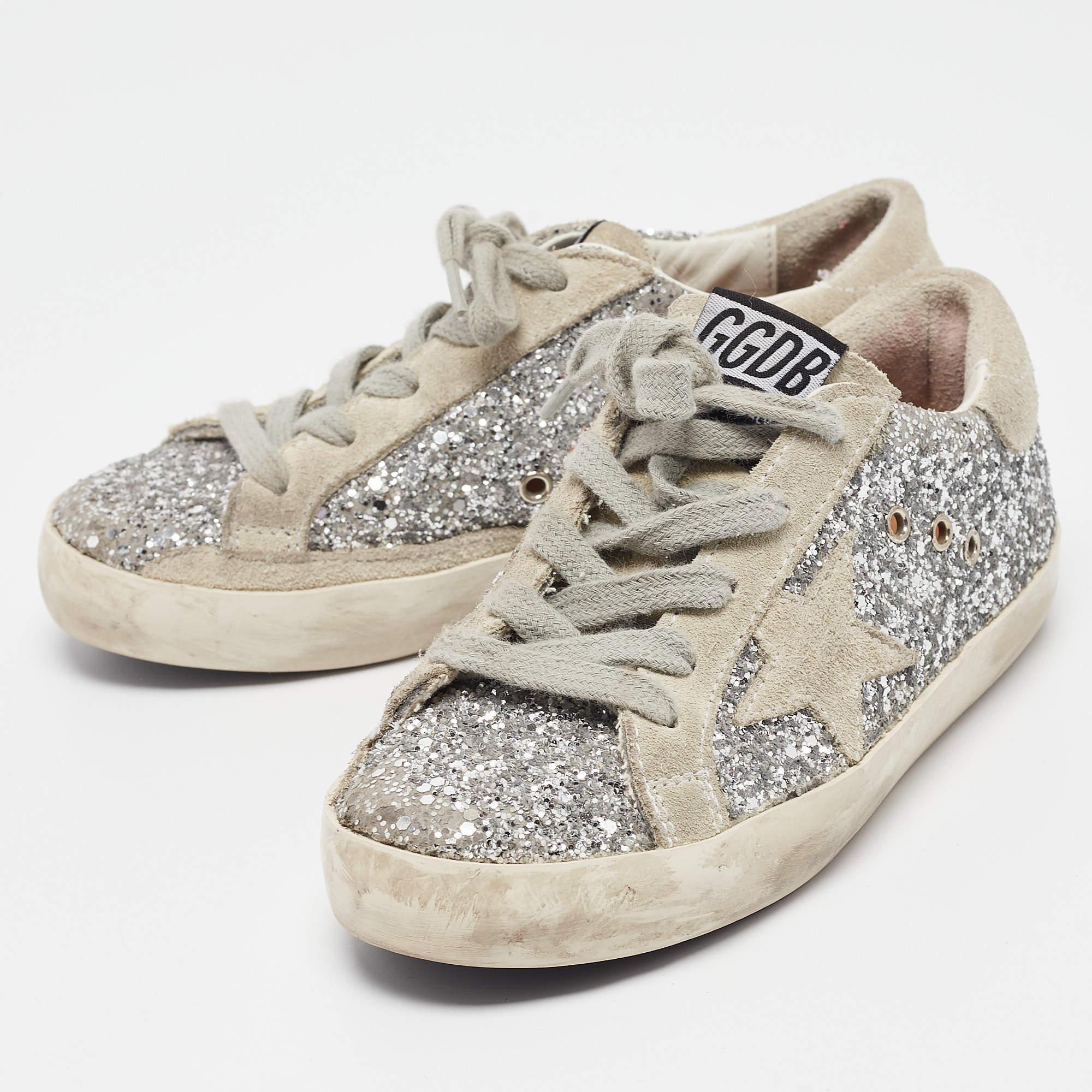 Coming in a classic silhouette these designer sneakers are a seamless combination of luxury comfort and style. These sneakers are finished with signature details and comfortable insoles.