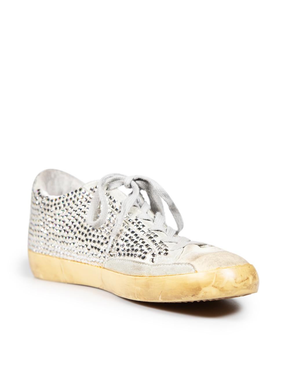 CONDITION is Very good. Minimal wear to the trainers is evident. Missing crystals the right side of the left shoe, left counter and the left side of the right shoe on this used Golden Goose designer resale item. This pair of shoes are intentionally