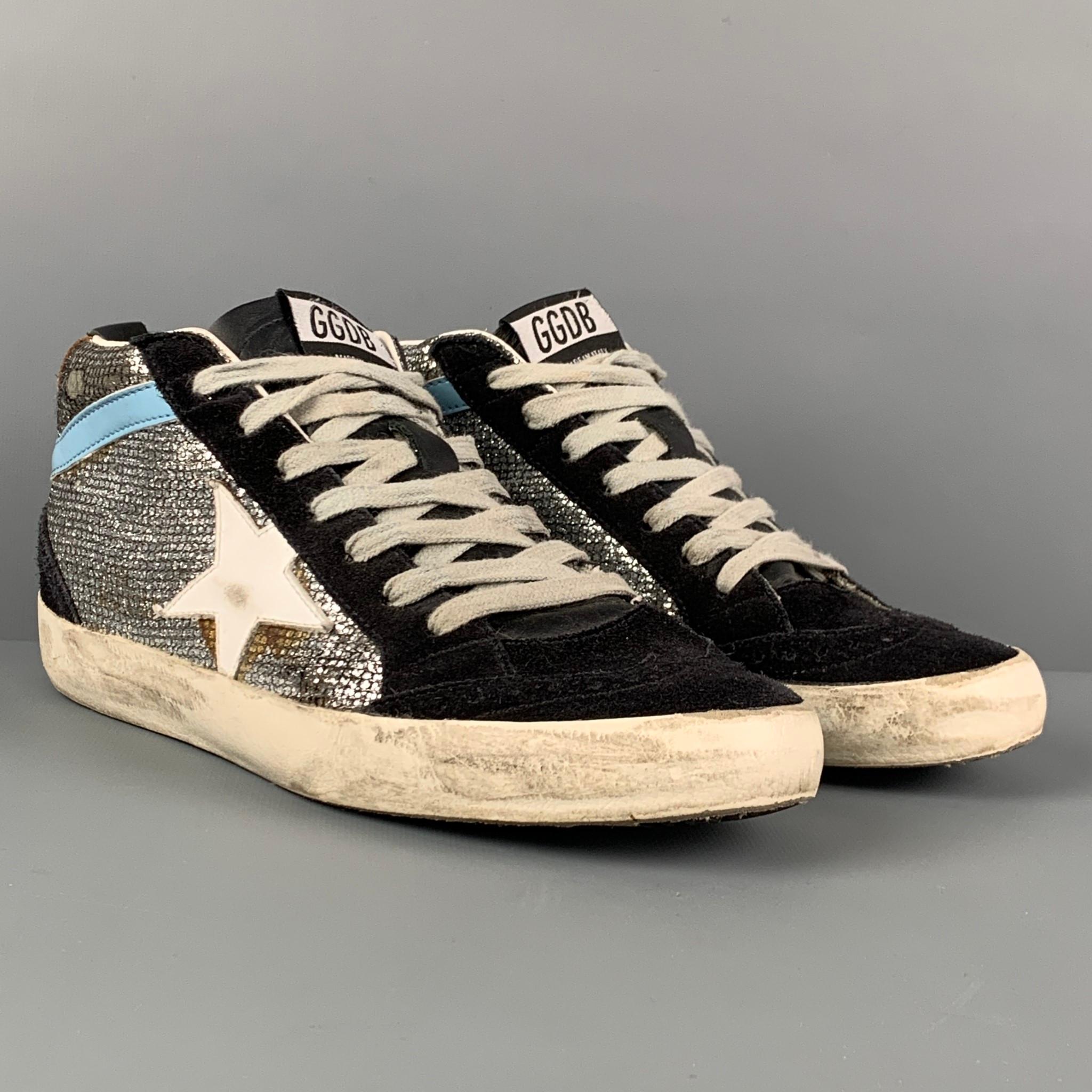 GOLDEN GOOSE sneakers comes in a silver & black suede featuring a metallic panel, signature distressed design, and a lace up closure. Made in Italy. 

Very Good Pre-Owned Condition.
Marked: 37
Original Retail Price: $525.00

Outsole: 10 in. x 3.25 in