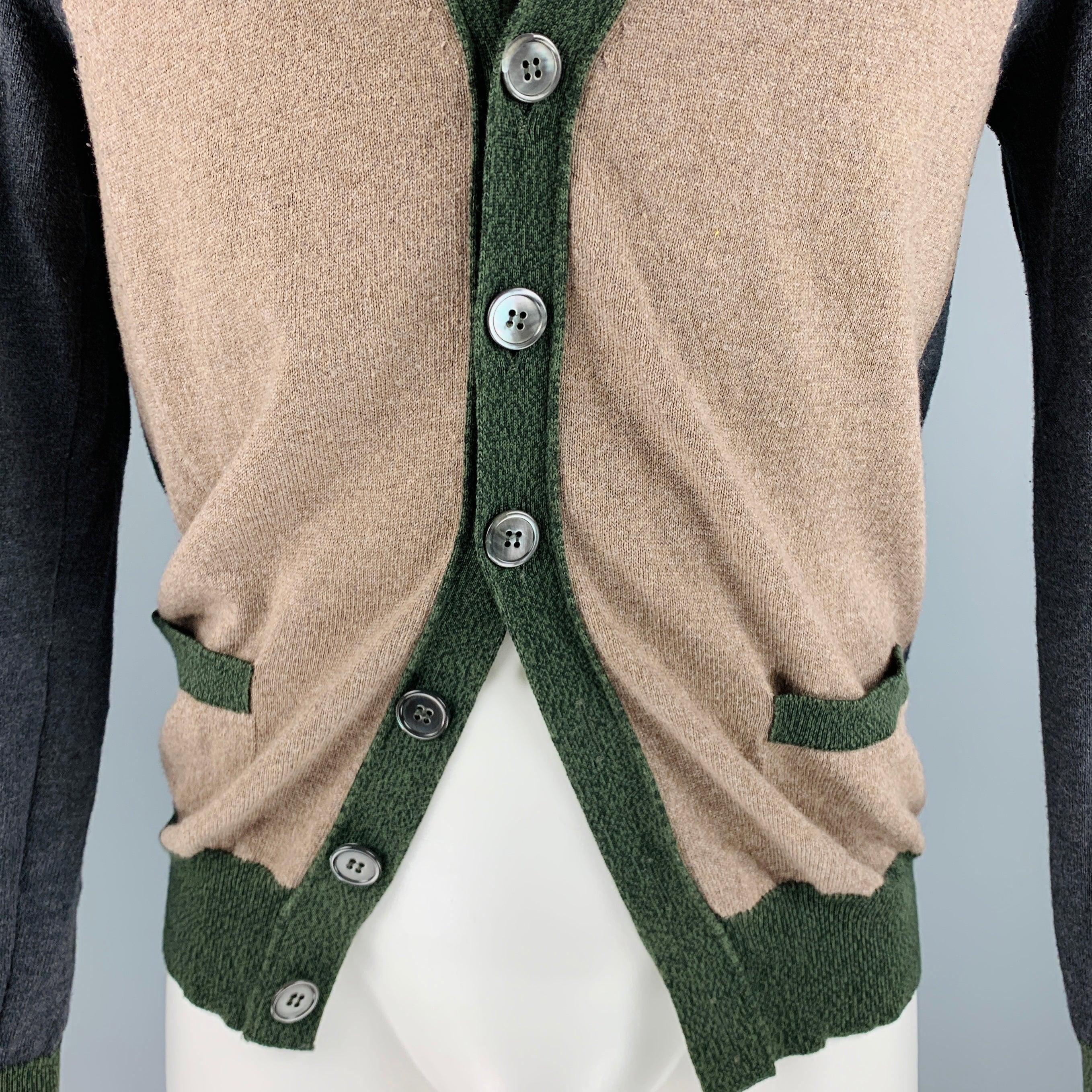 GOLDEN GOOSE cardigan
in a
brown and grey merino wool cotton blend knit featuring a color block style, two pockets, and button closure. Made in Italy.Very Good Pre-Owned Condition. Moderate signs of wear. 

Marked:   M 

Measurements: 
 
Shoulder: