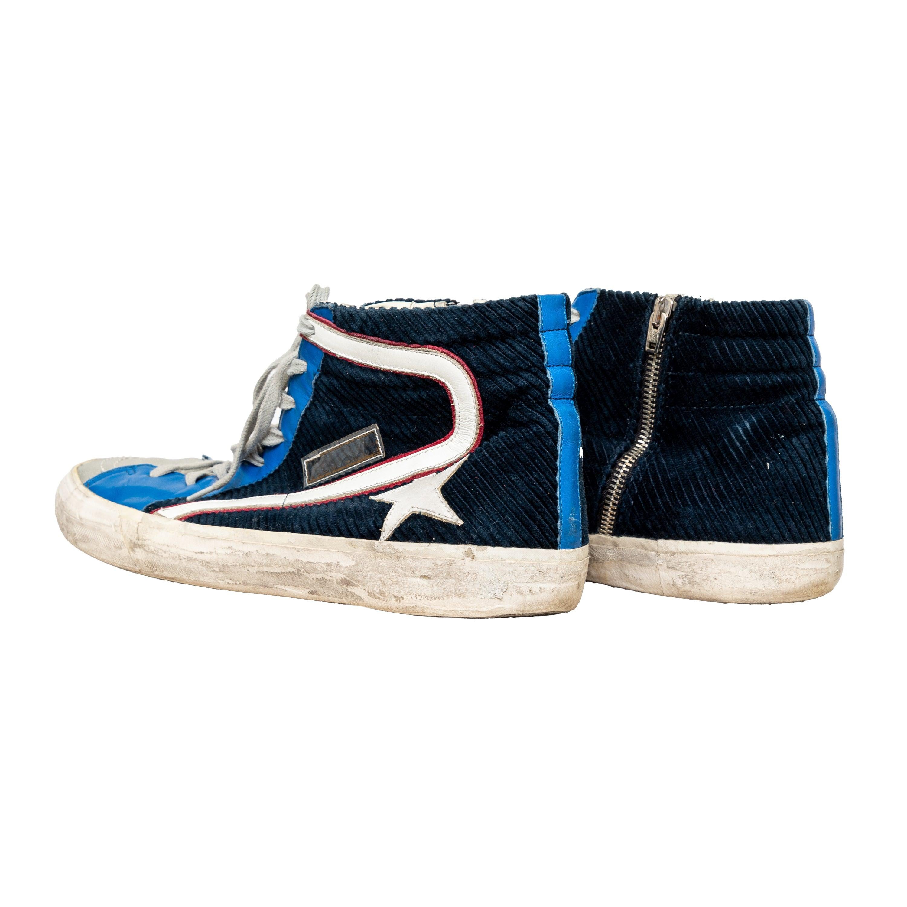 Featuring a high-top design, vintage used effect, and dark blue corduroy with leather trim, these sneakers showcase a logo and signature star patch for a bold style. 
 Measurement: Insole Length:30.5;Heel:3 
 Material: Leather  Fabric