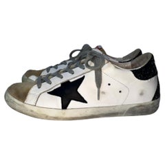 Zapatillas bajas «Super-Star» de Golden Goose con lengüeta brillante en la talonera, en piel de vacuno blanca