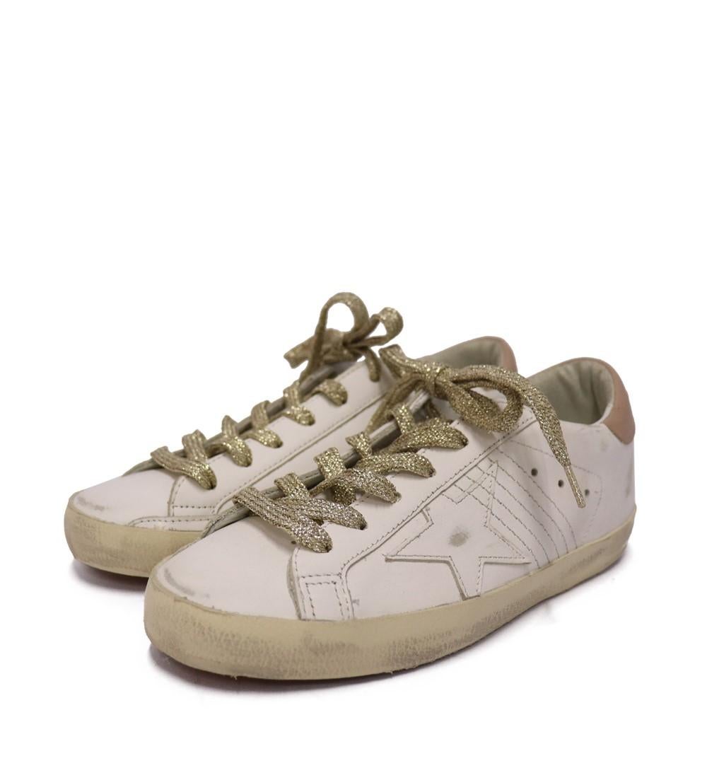 Golden Goose Super-Star Sneakers, Features leather star, leather heel tab, gold lurex laces, handmade and made in Italy.

Material:  100% cow leather
Size: EU 36
Condition: New

