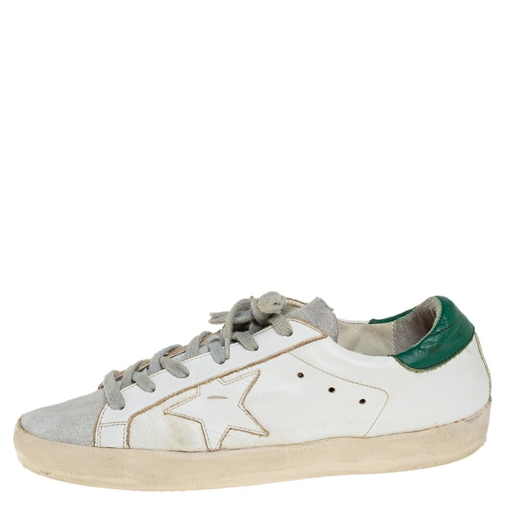 Enjoy footwear ease with this pair of sneakers by Golden Goose. They've been crafted from white leather and suede and are designed with round toes and lace-up on the vamps. The leather insoles and rubber soles add to the comfort of the pair

