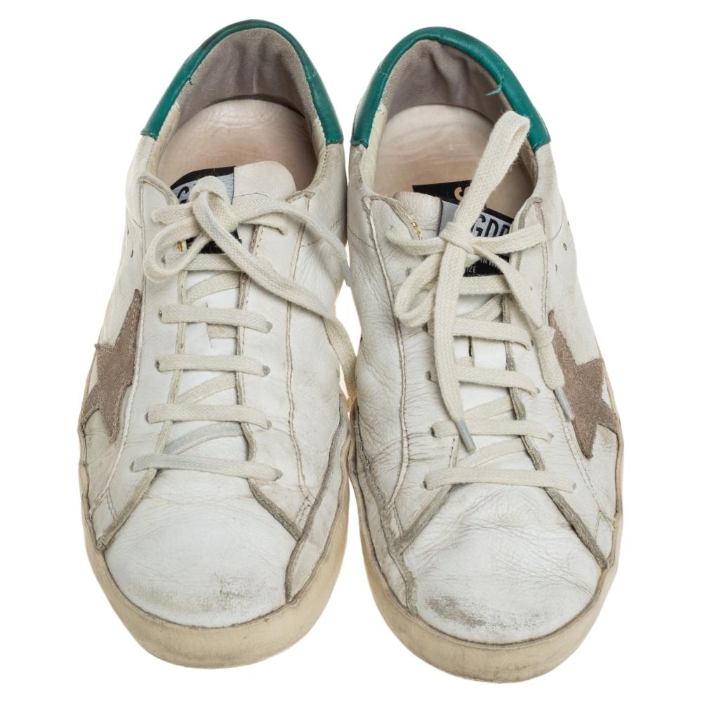 Founded in 2000, Golden Goose is hailed for meticulous craftsmanship in shoemaking and creative designs fused with a vintage appeal. Made from leather, they feature a distressed finish, laces on the vamps, and their signature star motifs on the