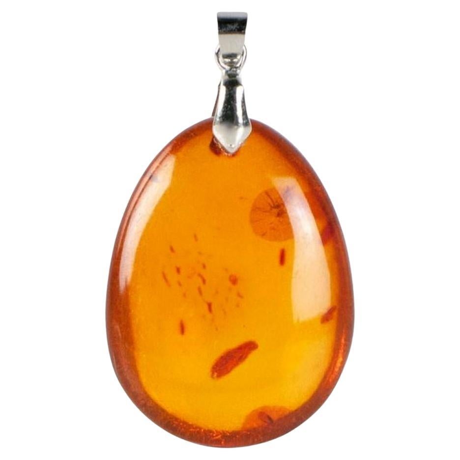 Pendentif ovale en ambre naturel miel doré