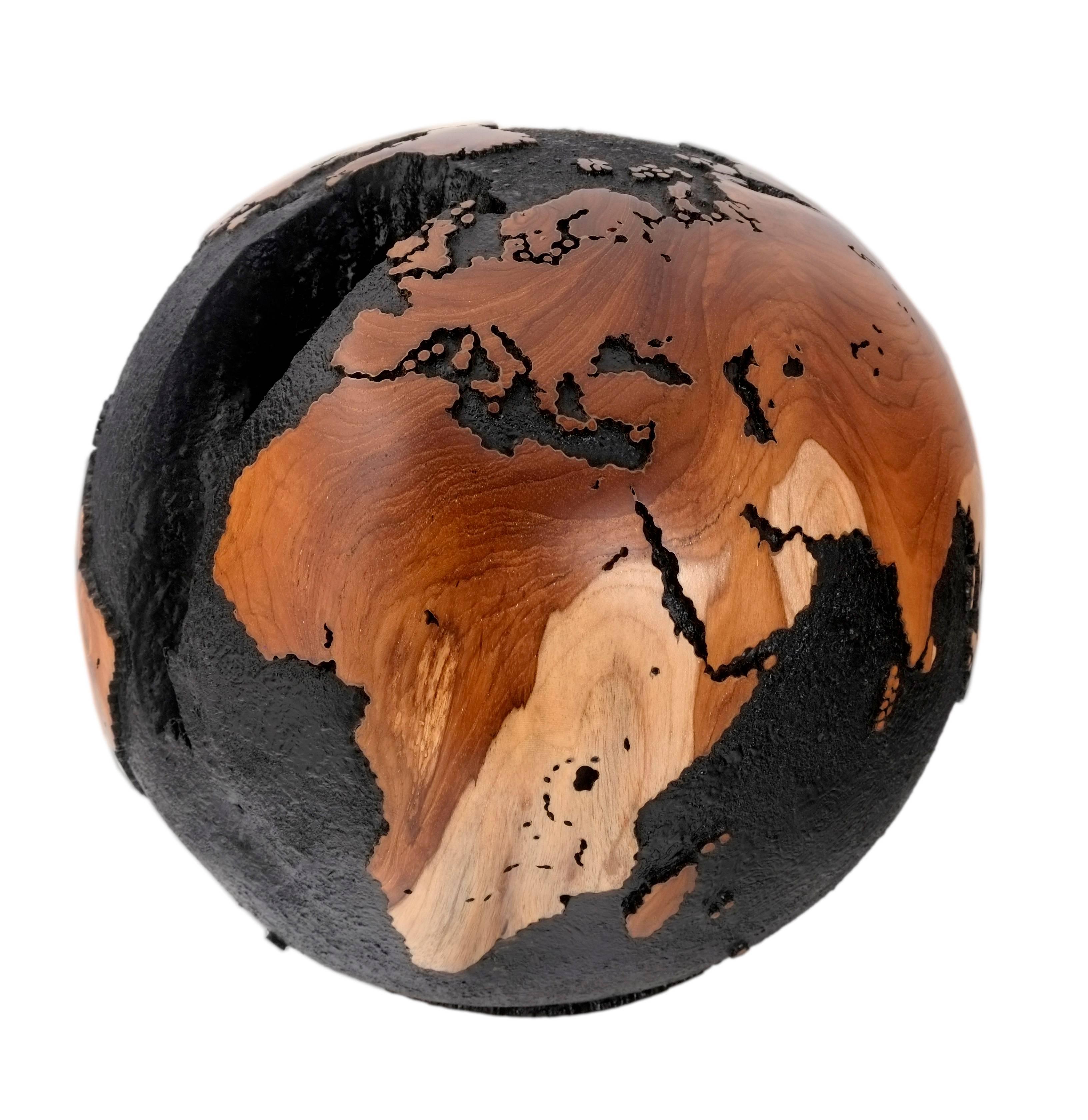 Don't bite at the bait of pleasure, till you know there's no hook beneath it.

Golden Hook Globe, is a hand-carved wooden globe with gold paint inlaid into a natural crevice of the teak root that resembles the shape of a hook that accents the