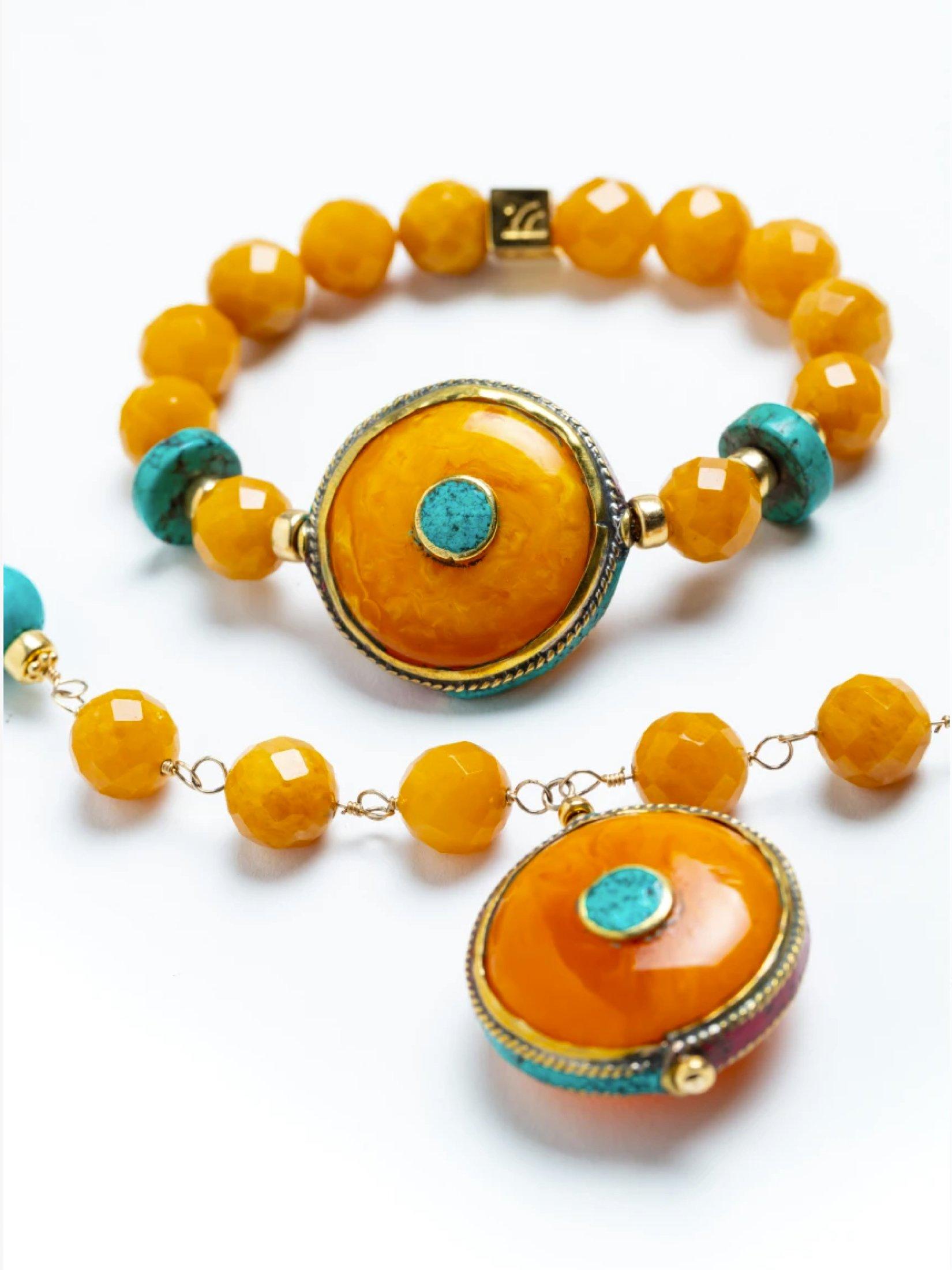 Story Behind the Jewelry
A key piece of a fall collection and tribute to our new designer Gracia.  The unique bracelet is comprised of golden jade and a Nepalese amber pendant.
Be sure to look at the matching necklace.

Properties
Golden Jade, Xiang