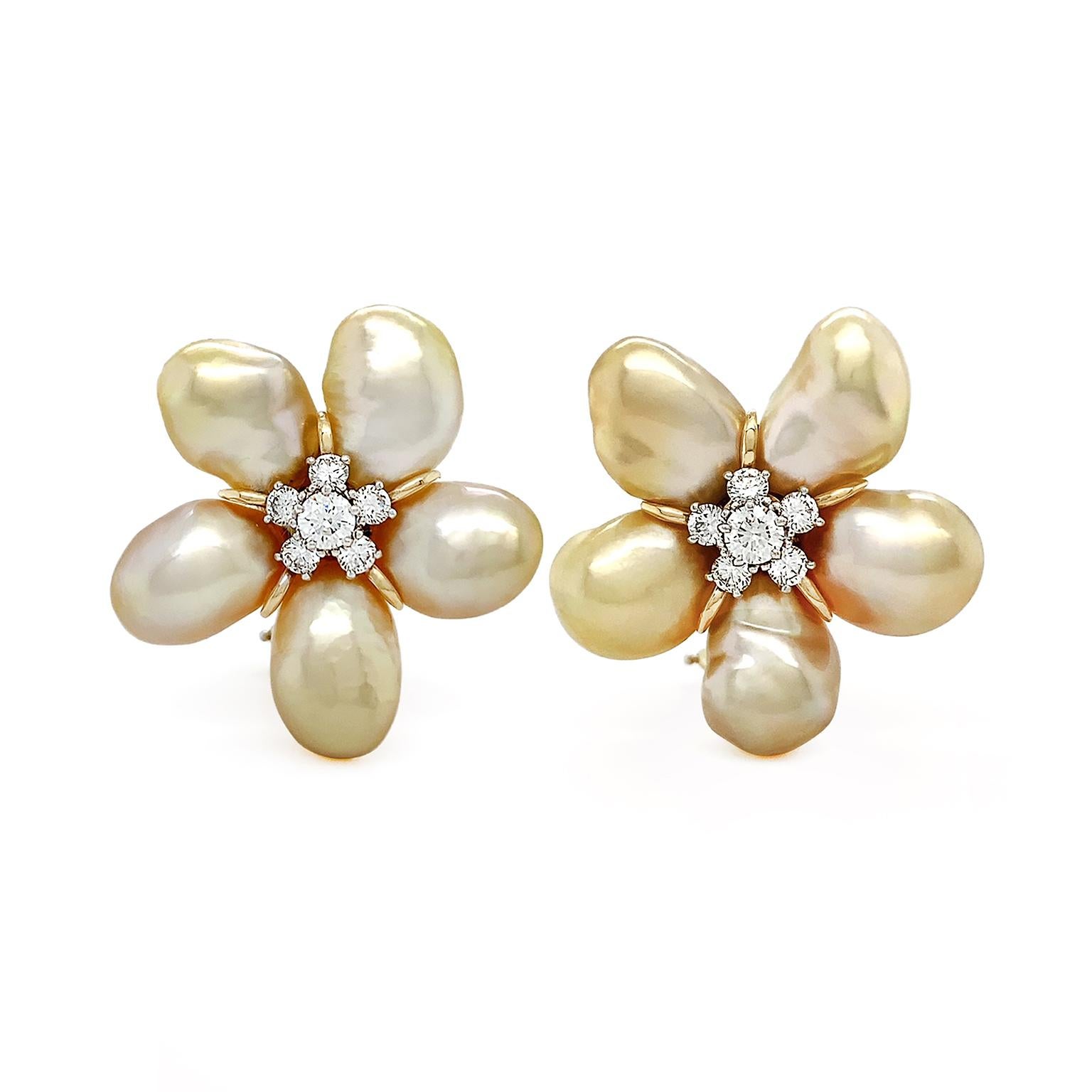Warm luster of gold keshi pearls combine with the brilliance of diamonds for these earrings. Five baroque gold keshi pearls are arranged in a circular pattern extending outward. Keshi pearls are known for their absence of a nucleus, creating prized