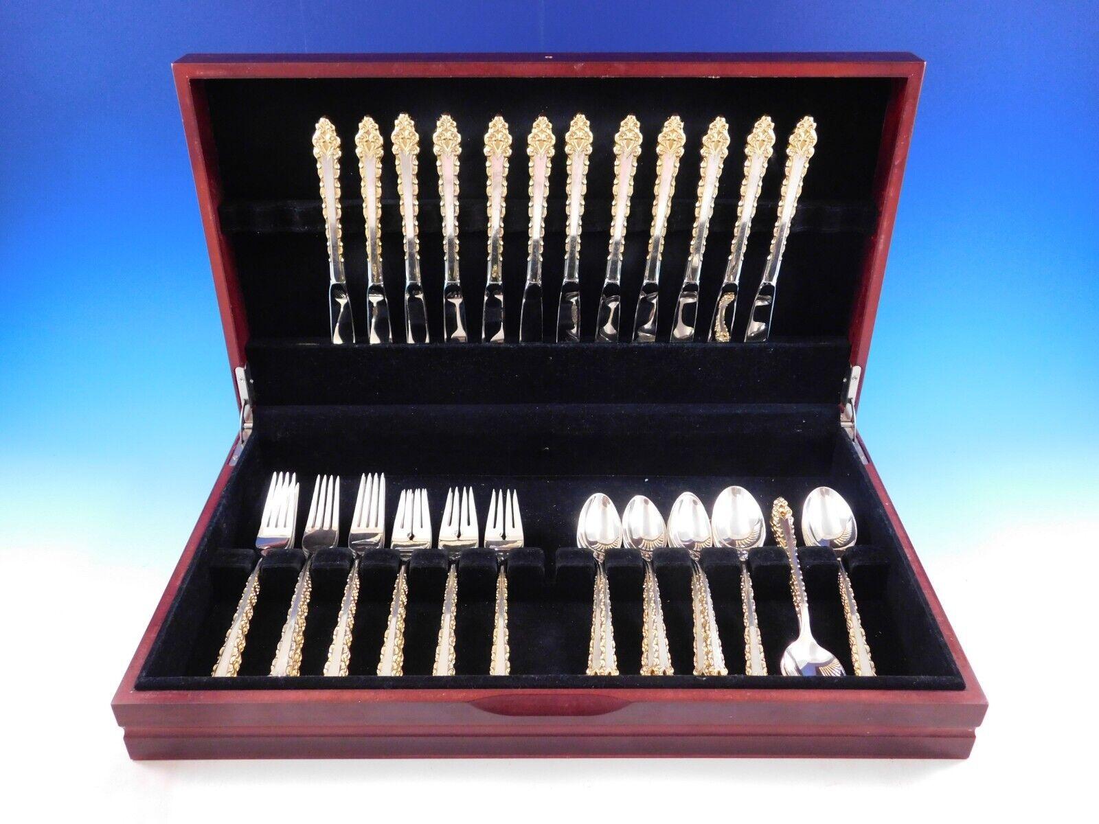 Golden La Strada by International c1972 pierced handle sterling silver with gold accent Flatware set - 60 pieces. This set includes:

12 Knives, 9 1/8
12 Forks, 7 3/4