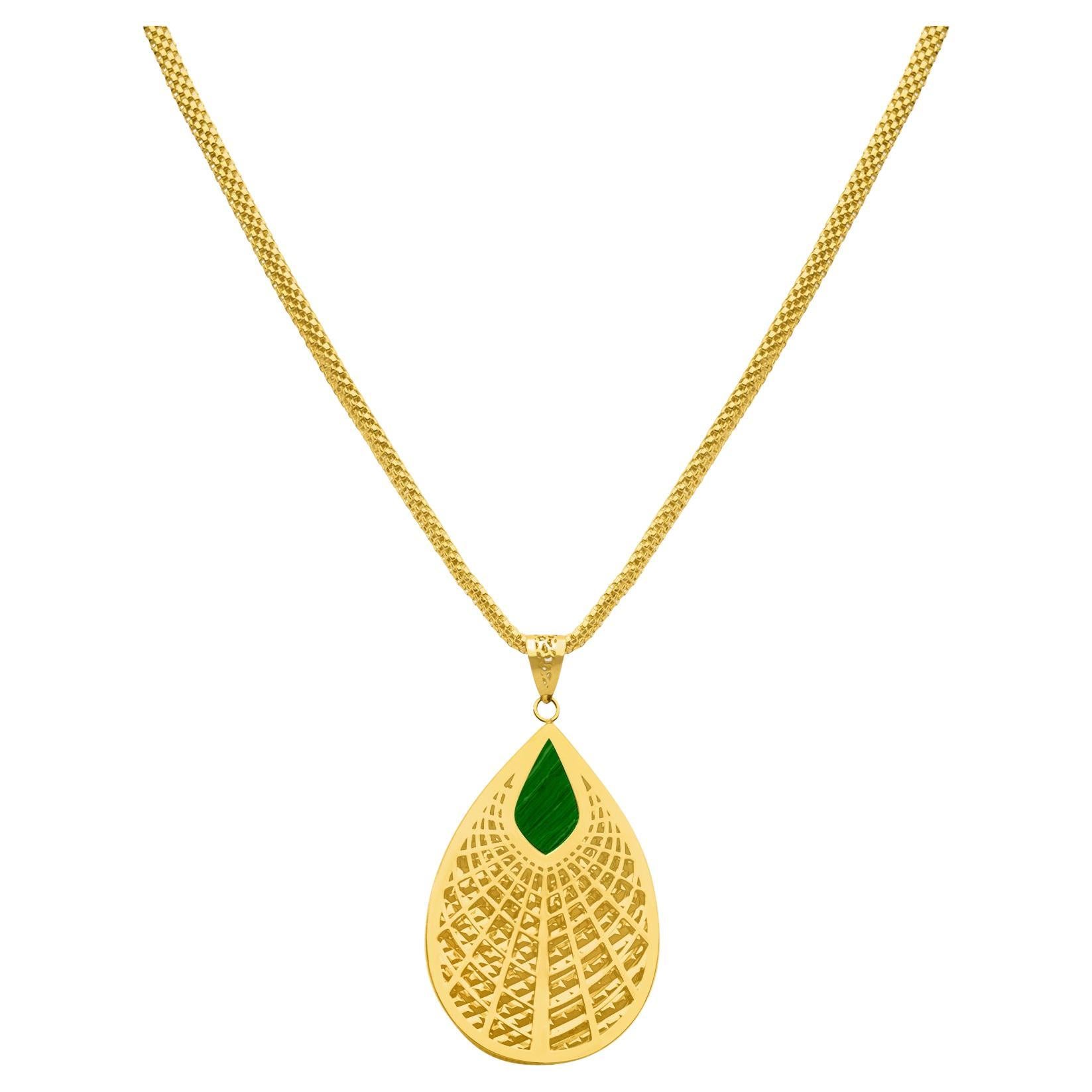 This Golden Leaf Pendant is a striking piece of handcrafted jewelry that embodies timeless elegance and natural symbolism. Designed in 14K solid gold, the pendant features a radiant lattice pattern that evokes the delicate geometry of a leaf,
