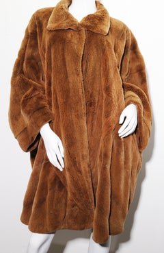 Golden lightweight sheared mink cape coat by Elena Benarroch
