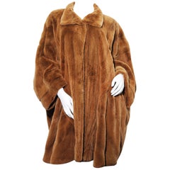 Golden lightweight sheared mink cape coat by Elena Benarroch 