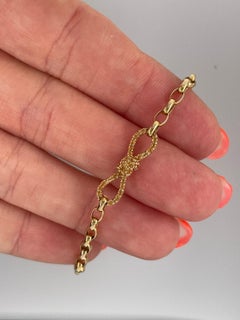 Golden Mandarin Garnet Bow pendant enhancer clasp in 18ct yellow gold