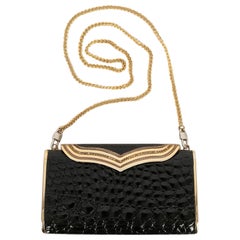 Borsa da sera in metallo dorato e vernice nera