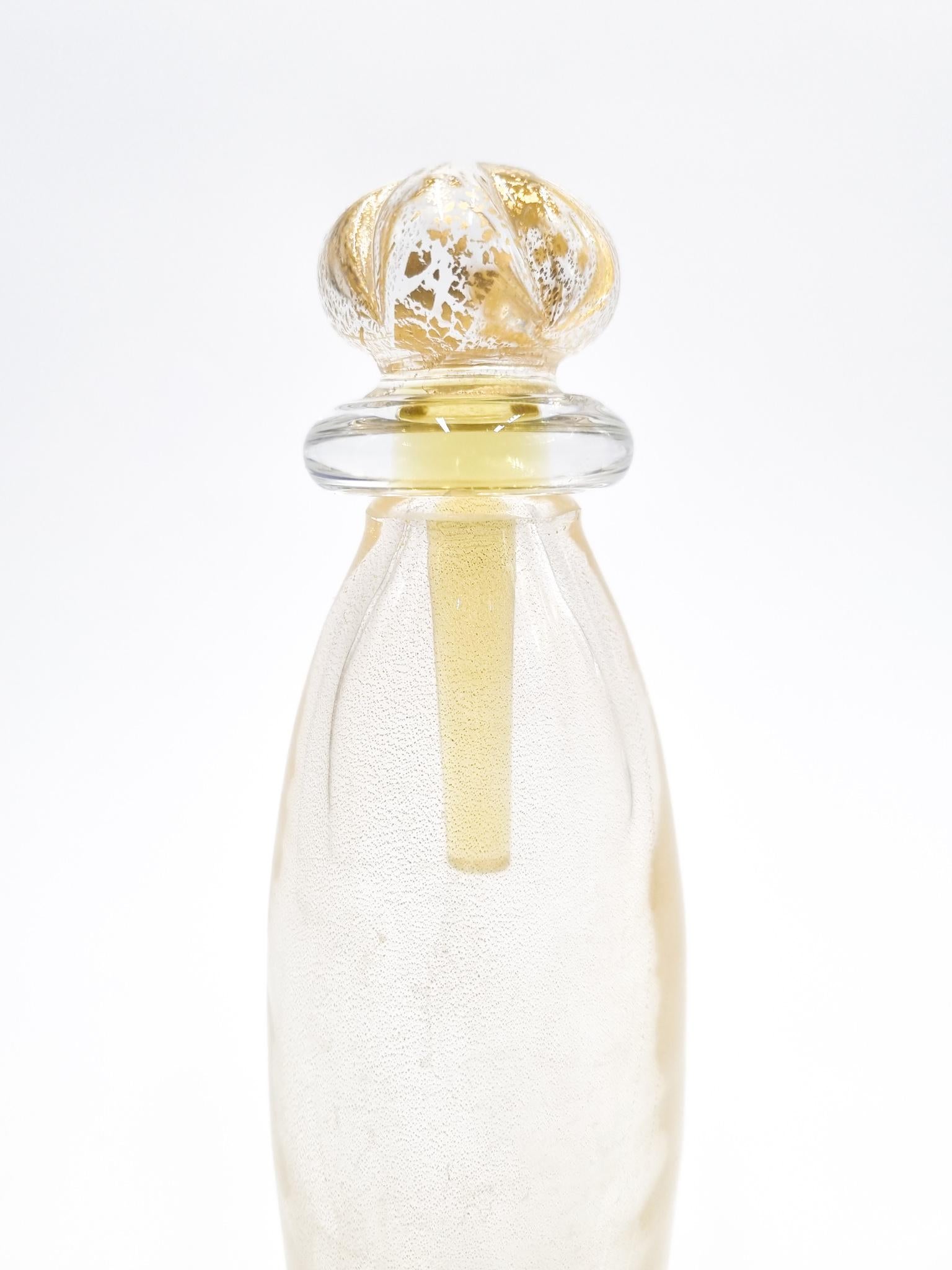 Murano glass bottle with gold inserts, made by Carlo Moretti in the 70s.

Measures: Ø cm 5, H cm 23

Carlo Nason, born in Murano in 1935 from one of the oldest glassmaking families on the island, he was a great master glassmaker. He grew up