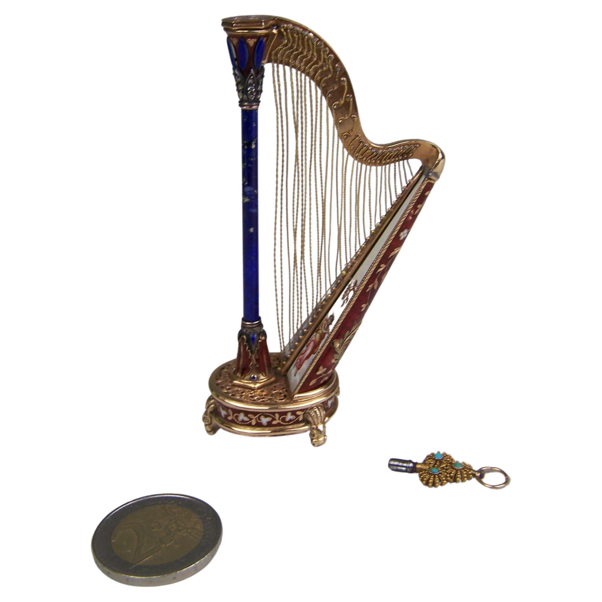 Golden Musical harp with enamel and precious stones by Köchert AE. For Sale