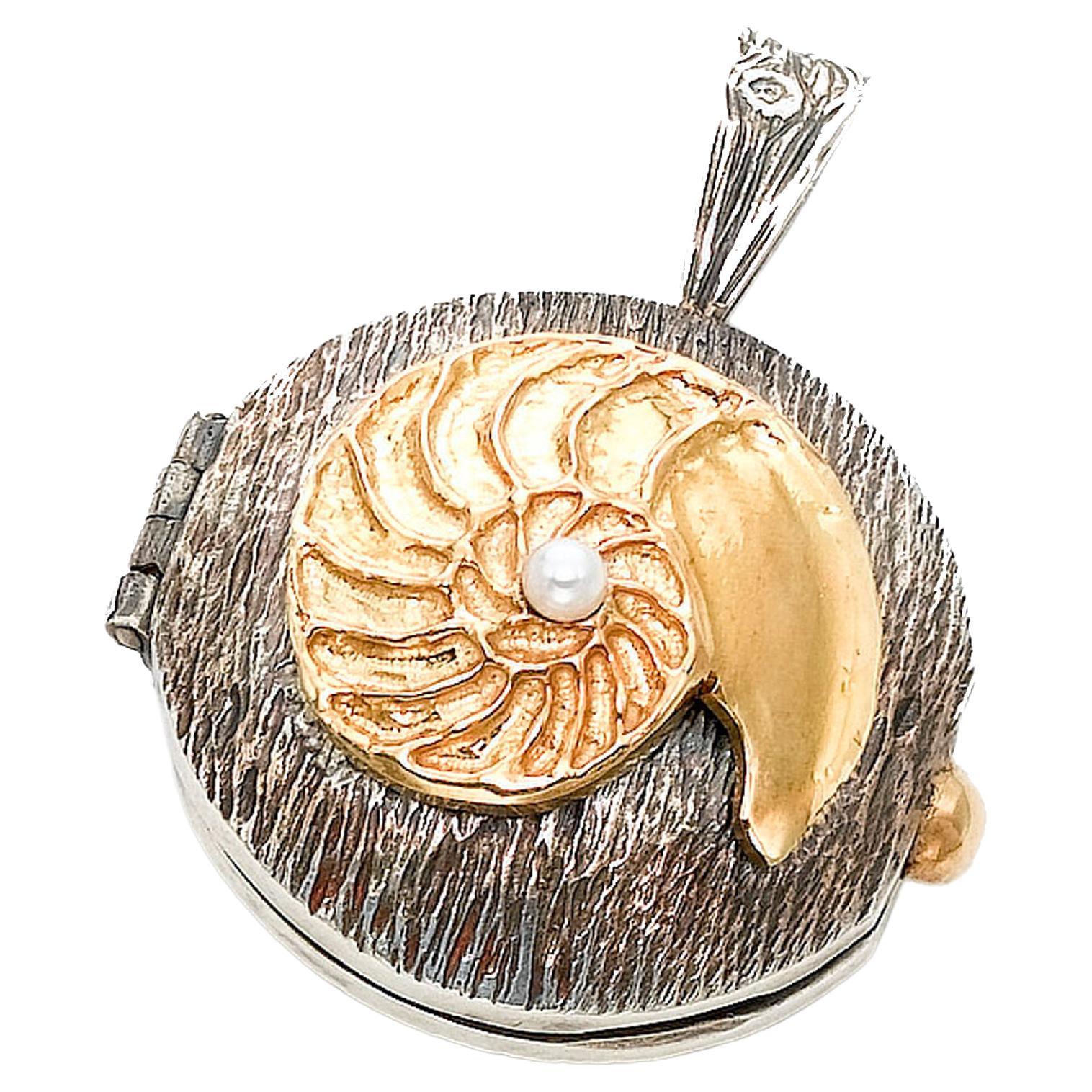 18k Golden Nautilus Hinged Locket with Hidden Spinels