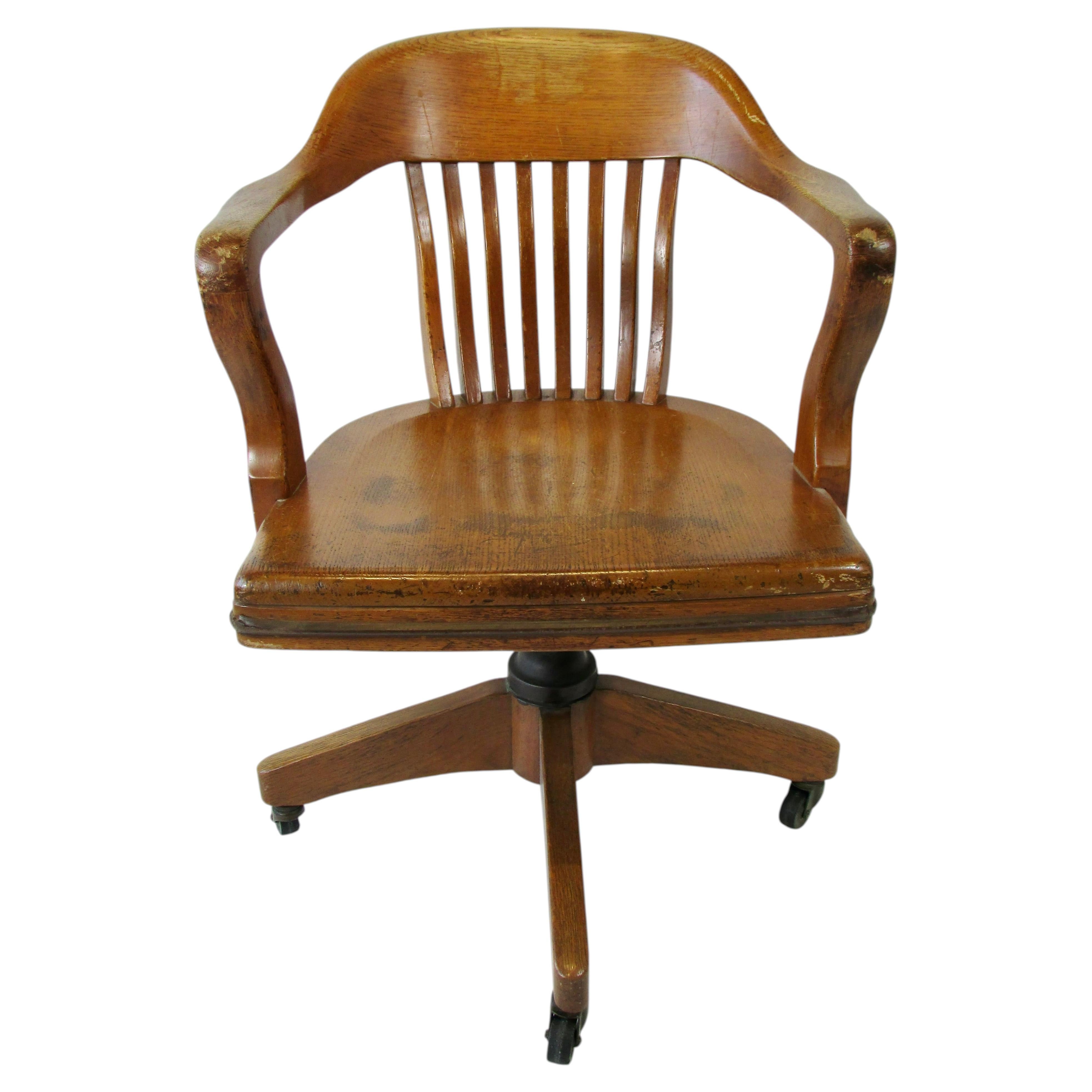 Golden oak swivel tilt English bankers desk or task chair in original finish