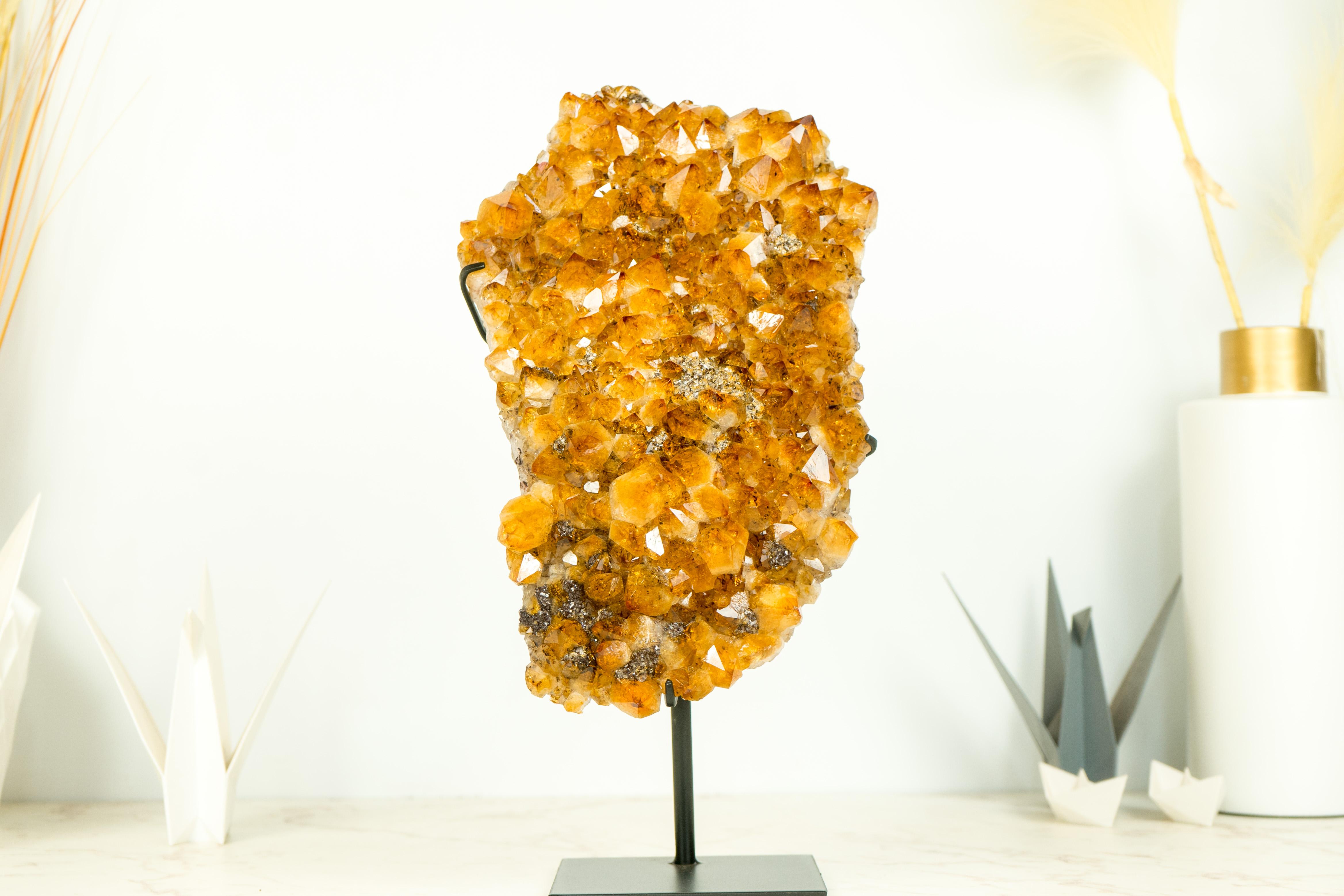 Gorgeous Natural Golden Orange Citrine Cluster on a Custom-Made Stand

▫️Description:
Beautifully formed and visually striking, this Citrine Cluster showcases unique characteristics that combine to create an AAA-grade specimen. This natural piece is
