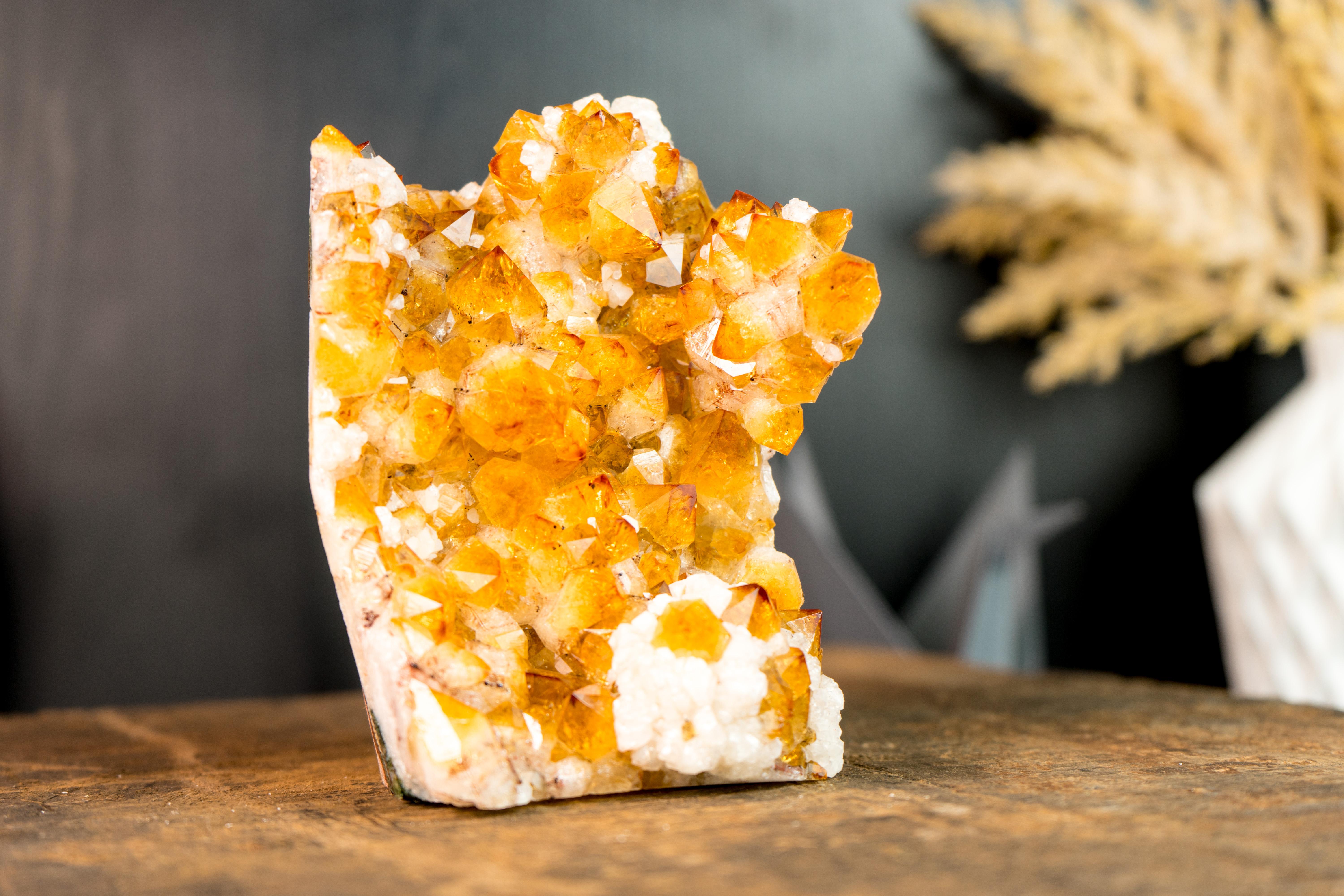 Bringing rare Stalactite Flower formations covered by dazzling Citrine Druzy and Calcite, this Citrine Cluster exemplifies a Natural Artwork that is ready to become the centerpiece of your collection, or the energetic source of your home