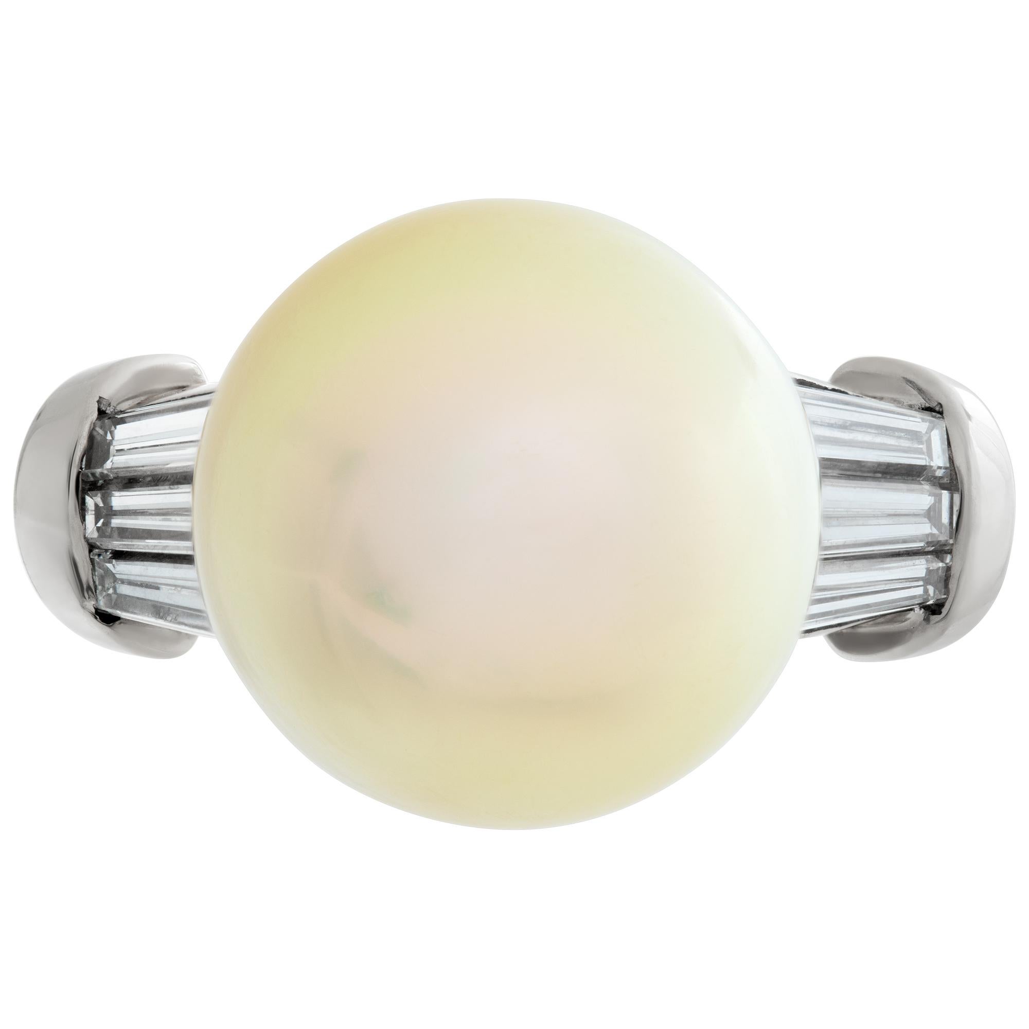 Golden South Sea pearl (13x 13.5mm) and tapered baguette diamonds ring set in 18K gold. Total baguette diamonds approx.weight: 0.90 carat. Size 7.This Pearl/diamond ring is currently size 7 and some items can be sized up or down, please ask! It