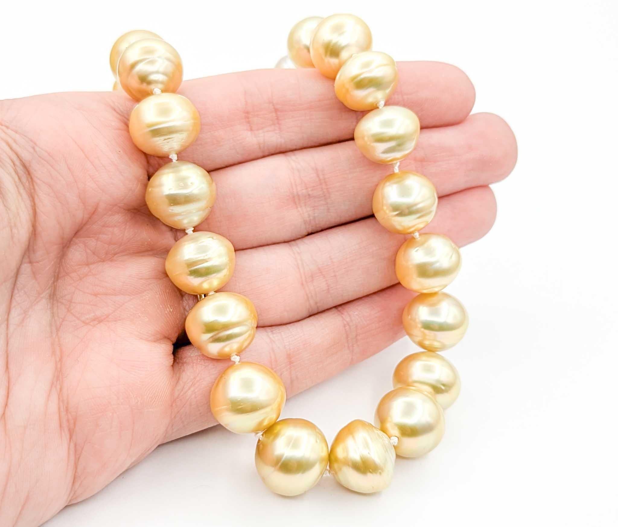 Lustrous Golden Pearl Necklace Strand in 14k Yellow Gold

This lustrous Pearl Necklace Strand is crafted in 14k yellow gold and features exquisite Golden South Sea pearls, graduating from 10mm to 14mm. Known for their rich golden hue and exceptional