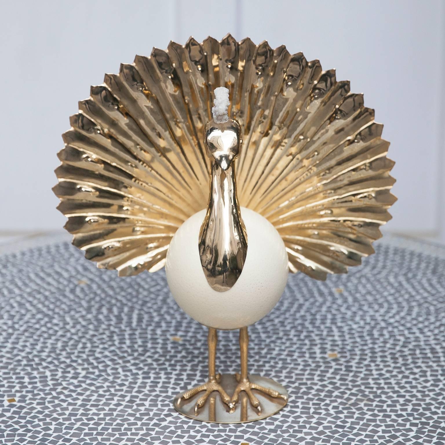 Gold-plated Phoenix sculpture in the manner of Gabriella Crespi with an ostrich egg body and a white coral crown on the head, made in Italy in 1970s.