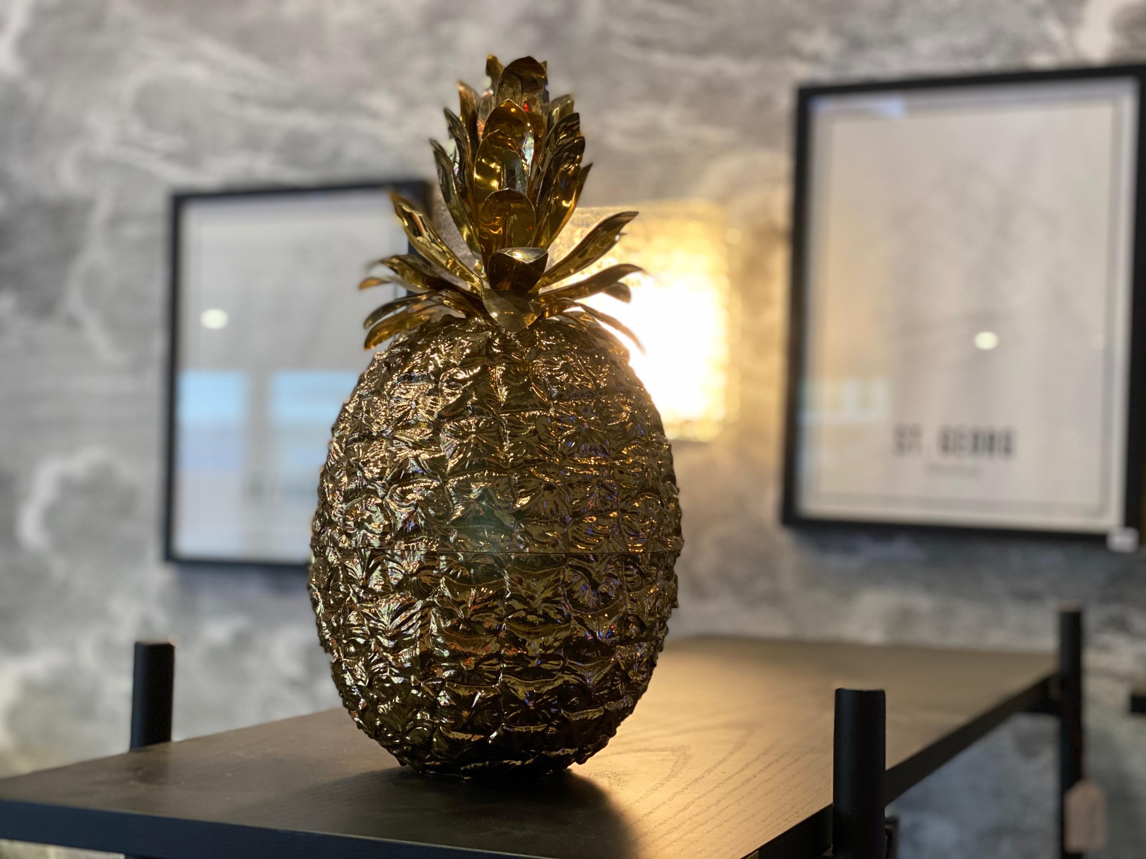 Beautiful golden pineapple ice bucket, designed by Hans Turnwald for the Swiss company Freddo Therm. This detailed ice bucket in the shape of a pineapple is a beautiful, luxurious addition to your home bar or simply as a special decoration for that
