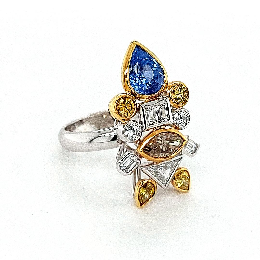 Pear Cut 18kt white Gold Ring Depicting a Fish with 2.03ct Diamonds, 2.29ct Sapphires For Sale