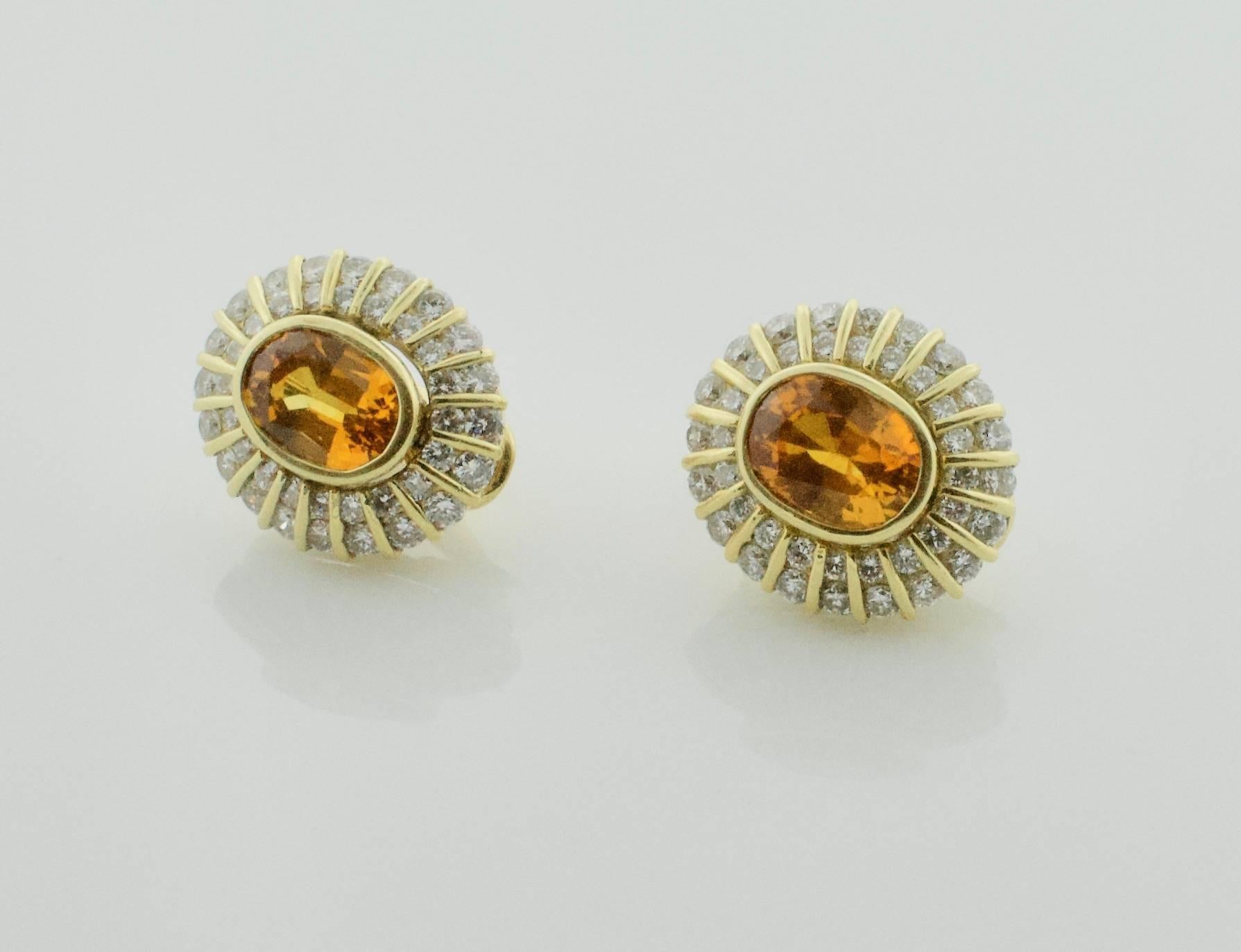 Golden Sapphire and Diamond Clip Earrings in 18k
Two Matched Golden Sapphires  weighing 5.20 carats approximately [bright and vibrant with no imperfections visible to the naked eye]
Eighty Round Brilliant Cut Diamonds weighing 2.60 carats