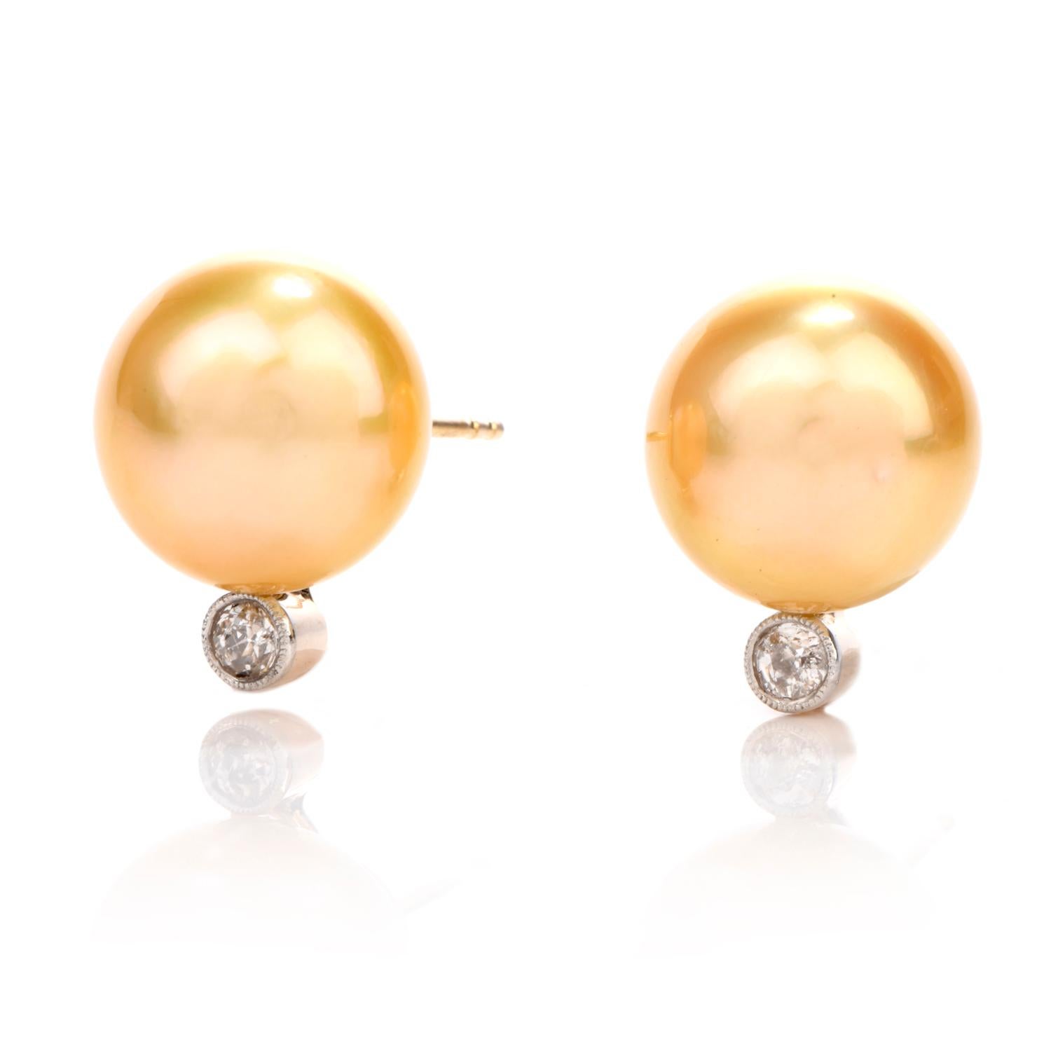 These beautiful and lustorous earrings were crafted in 18K gold.

Featuring 2 appx. 13mm  Golden South Sea Pearls and

2 natural rose cut round faceted diamonds.

Diamonds weigh appx. 0.30 carats and are of H-I color and VS clarity.

Secured with