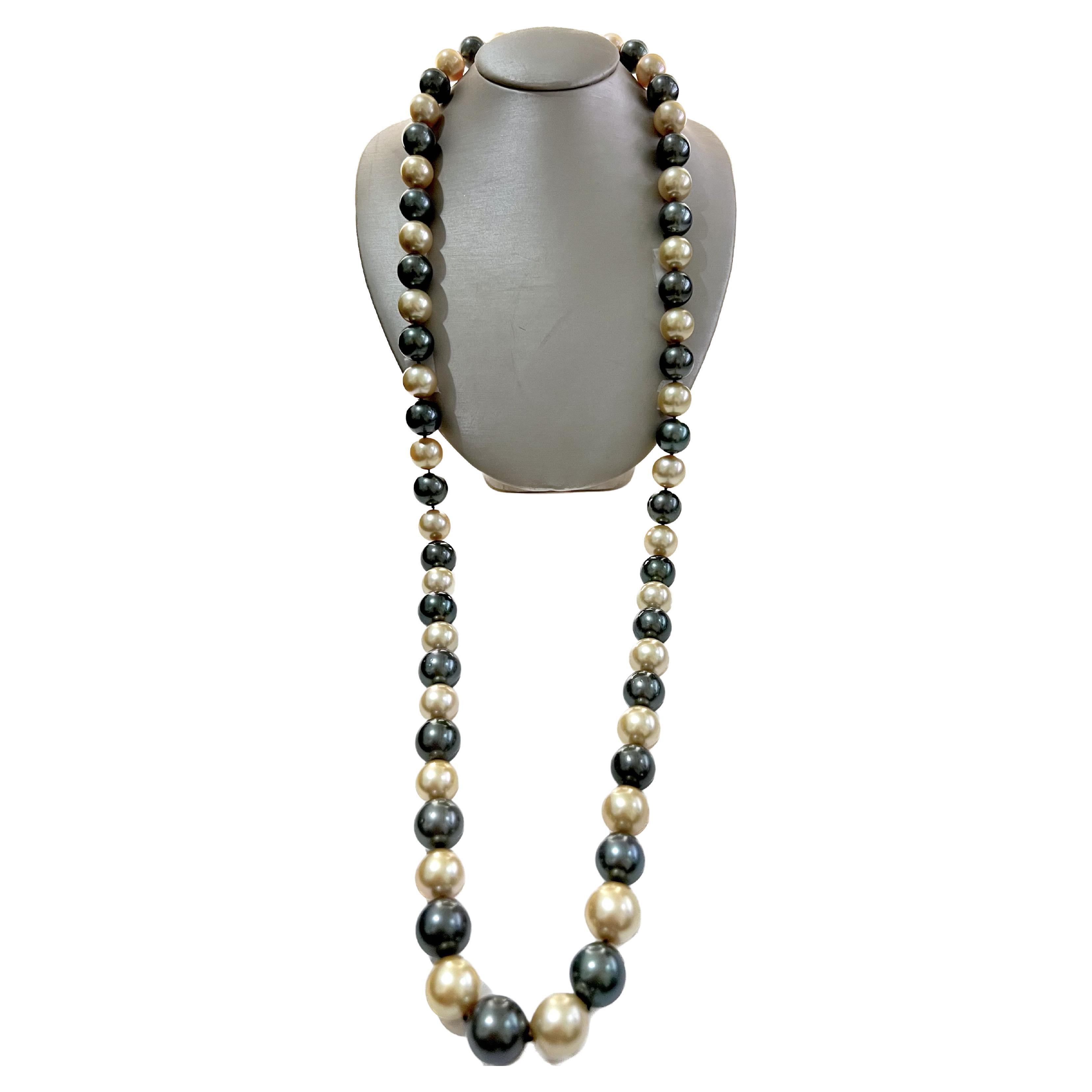 This strand of pearls is absolutely stunning.  The rich, old South Sea pearls are alternating with the black Tahitian pearls to give a royal, elegant look.  The pearls range from 12 mm - 15.70 mm in size and is approximately 34.5 inches in length. 