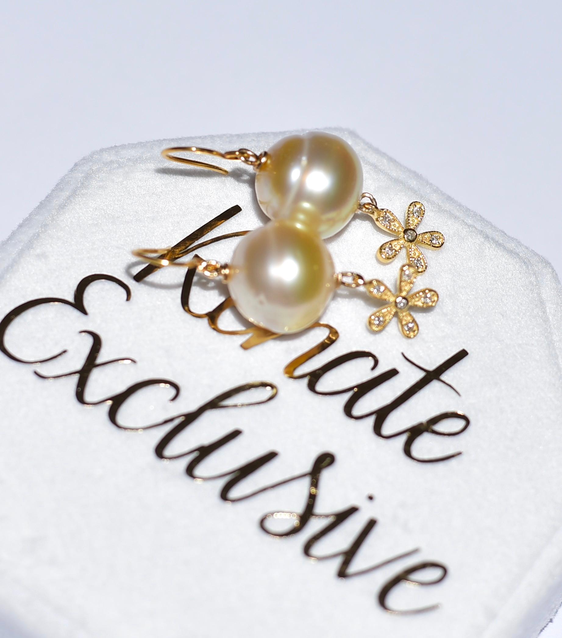 If you like pearls and diamonds, then this simple and beautiful piece of jewelry is for you!
Light Golden South Sea Cultured Pearl (13,2mm x 14mm) with sparkling and cute 14K solid Yellow Gold Diamond 5 petal flower Charm. Absolutely lovely look!