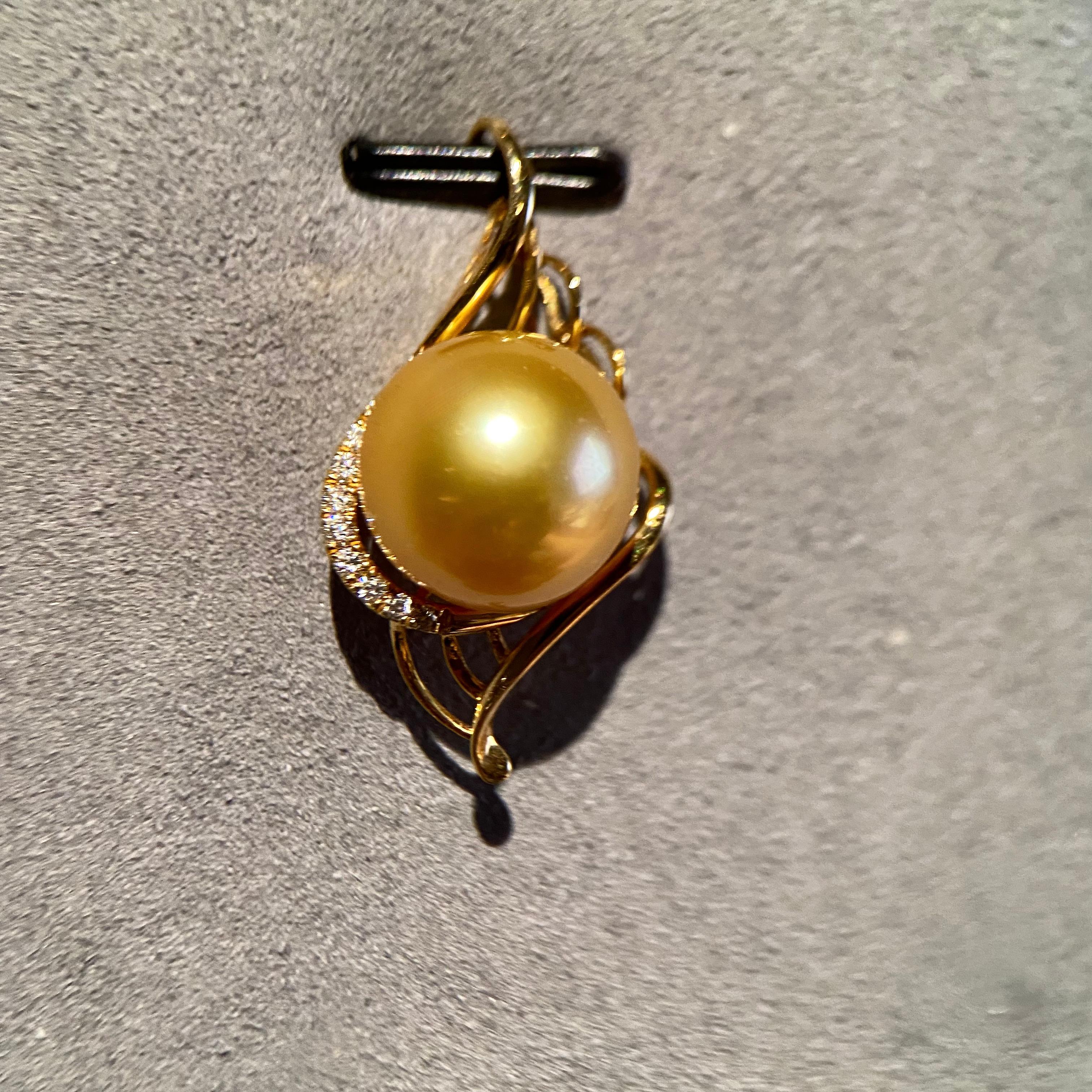 A 11.1 mm Light Golden Colour South Sea Pearl and Diamond Pendant in 18k Yellow Gold
It consists of a round Shape South Sea Pearl with excellent Lustre and Very Minor Surface Blemish.
The Pearl is Light Gold in colour with Pink Overtone 
Total