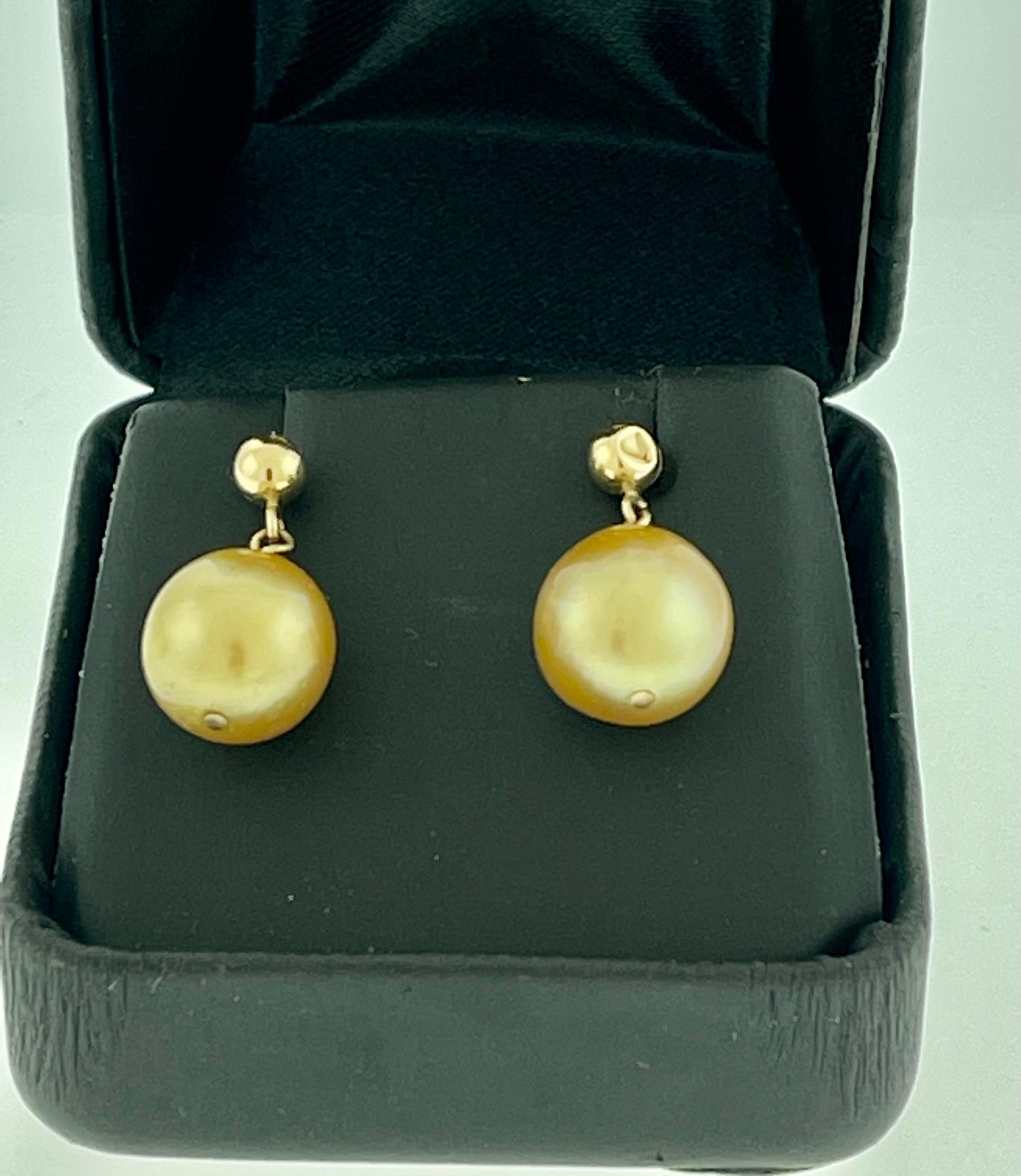 Women's Golden South Sea Pearl Dangling Earrings 14 Karat Yellow Gold For Sale