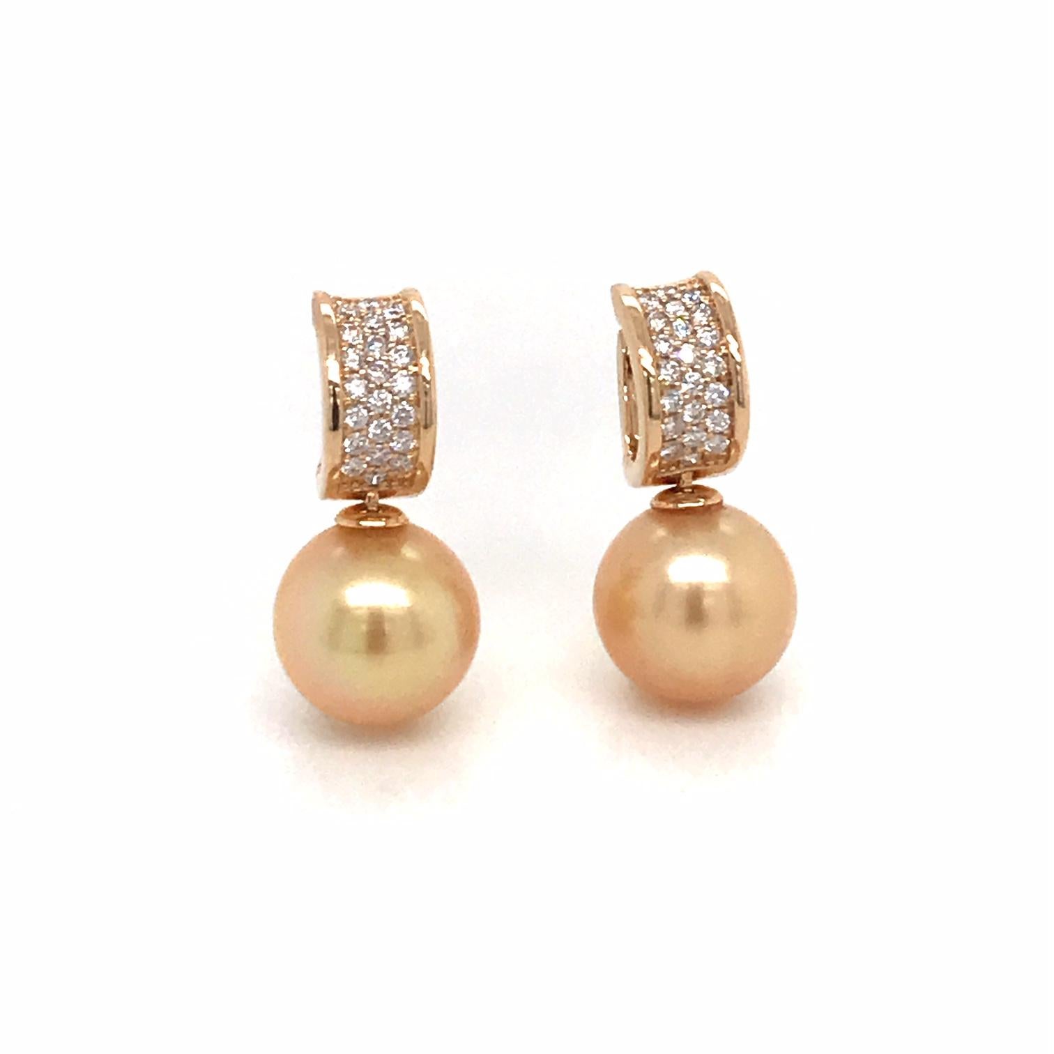 18K Yellow gold drop earrings featuring two Golden South Sea Pearls measuring 11-12 mm with 44 round brilliants weighing 0.43 carats.
Color G-H
Clarity SI

Pearl can be changed to a Pink, White or Tahitian Pearl upon request. Price subject to