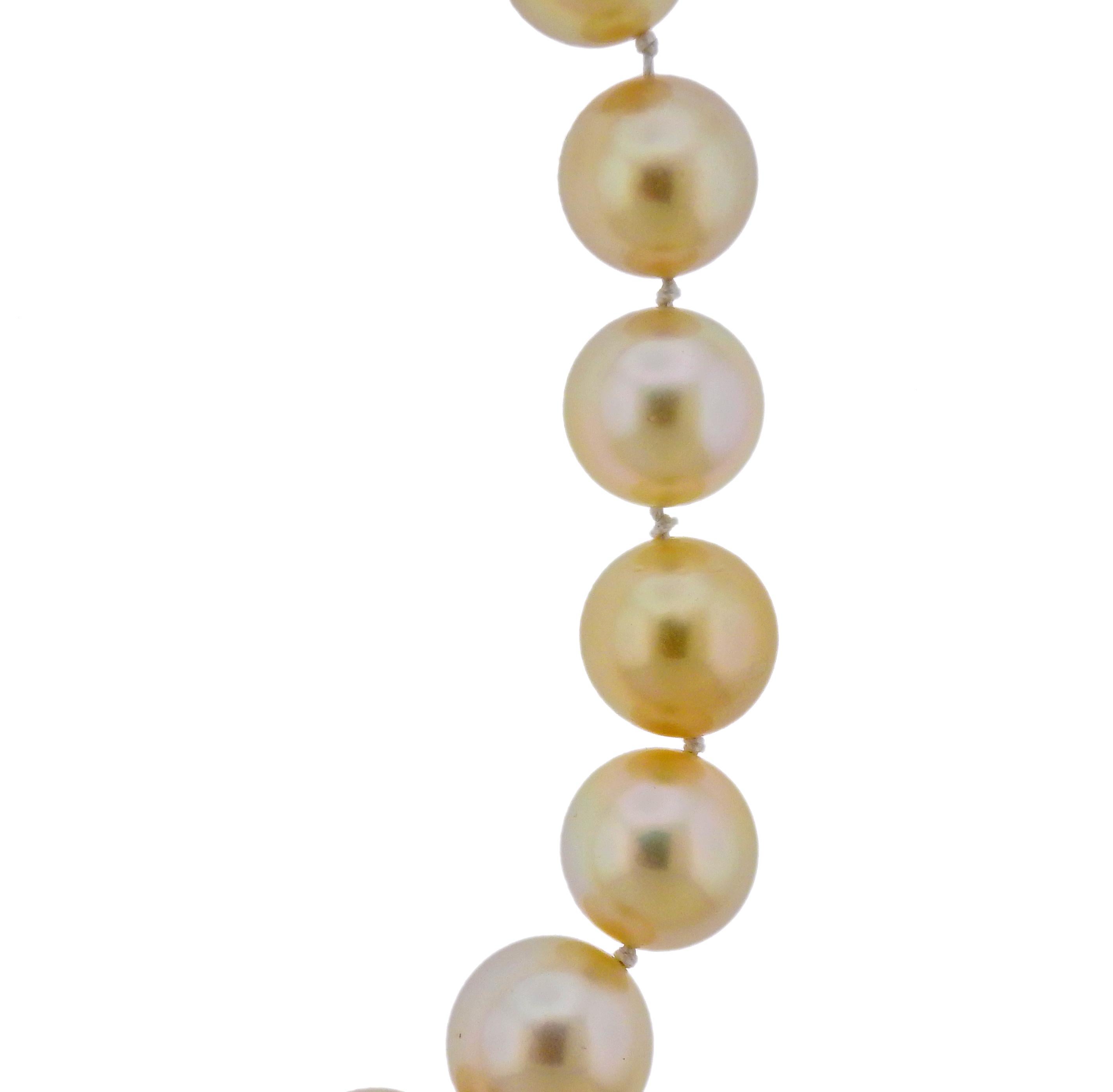 14k gold screw-in clasp with golden South Sea pearls, measuring approx. from  12.3mm to 13mm. Necklace 17