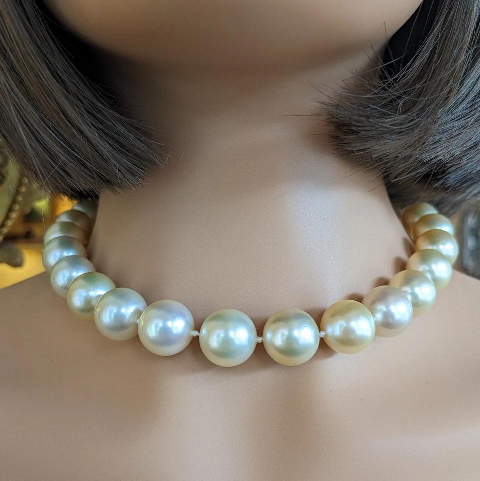 Golden South Sea Pearl Necklace 16.8 inches 18k White Gold Diamond Clasp

Golden South Sea Pearl Necklace features 28 Golden South Sea Pearls with colors ranging from Light Golden to Medium Golden measuring between 13 and 14.5 mm and secured by an