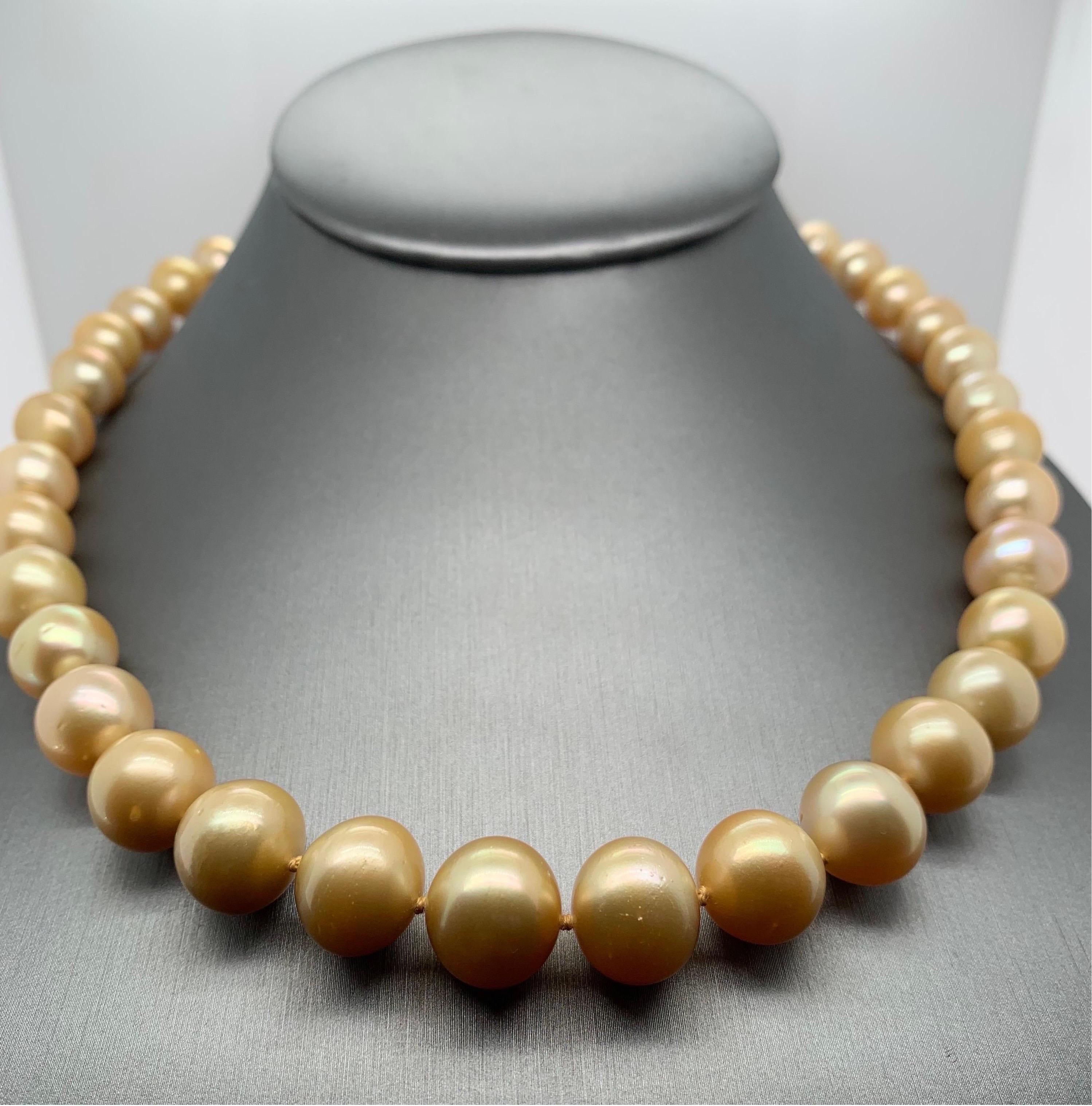 Elevate your look with a timeless graduated pearl necklace. This 18-19 inches long strand necklace is fully knotted and hand strung with matching silk cord. The necklace comprises 39 vivid sheen golden south sea pearls measuring 10-13.5mm and