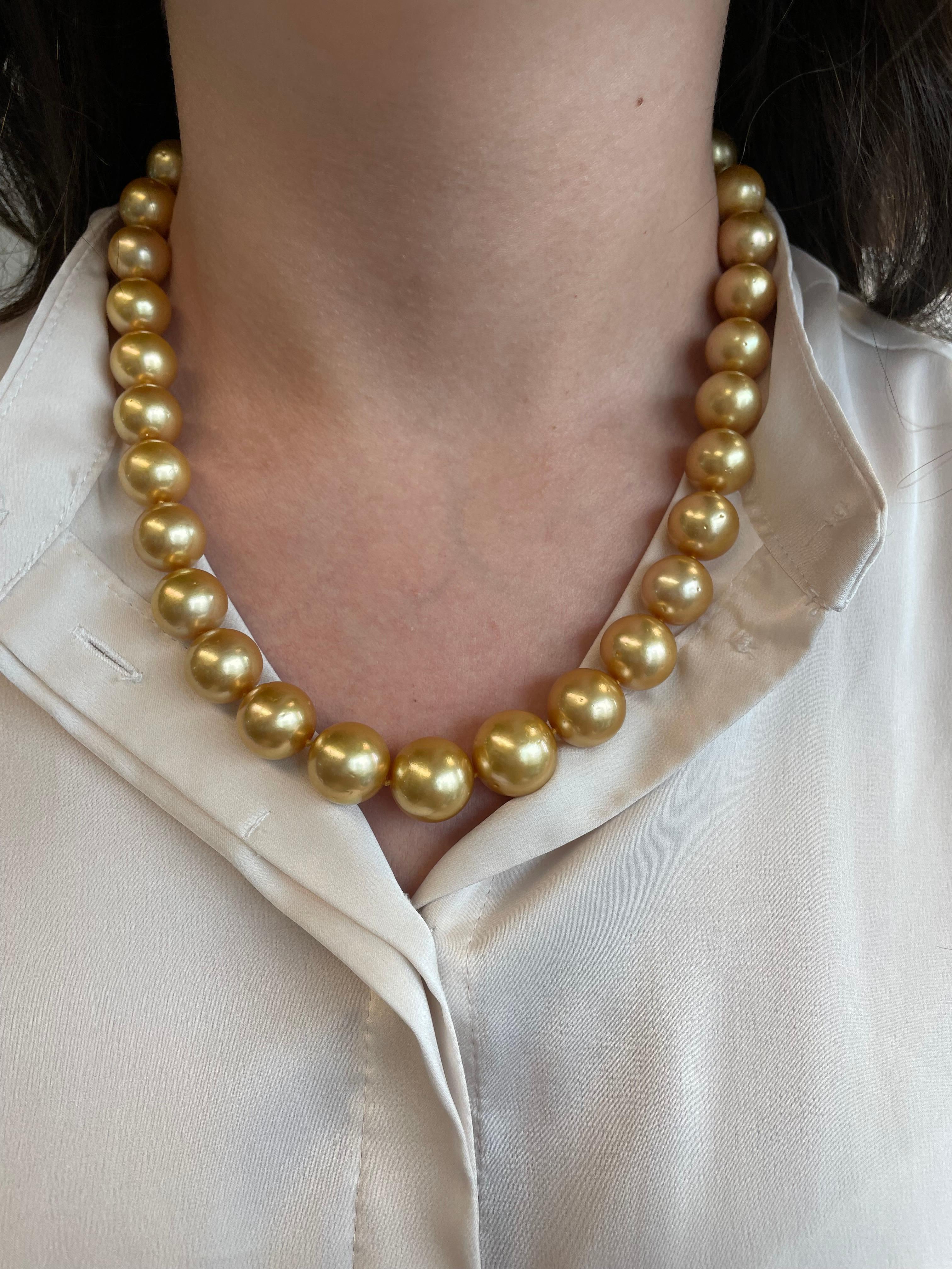 33 golden South Sea pearls, graduated from 15-12mm.
Yellow gold clasp with diamonds. 
Accommodated with an up to date appraisal by a GIA G.G. upon request. Please contact us with any questions.

Item Number 
N6461