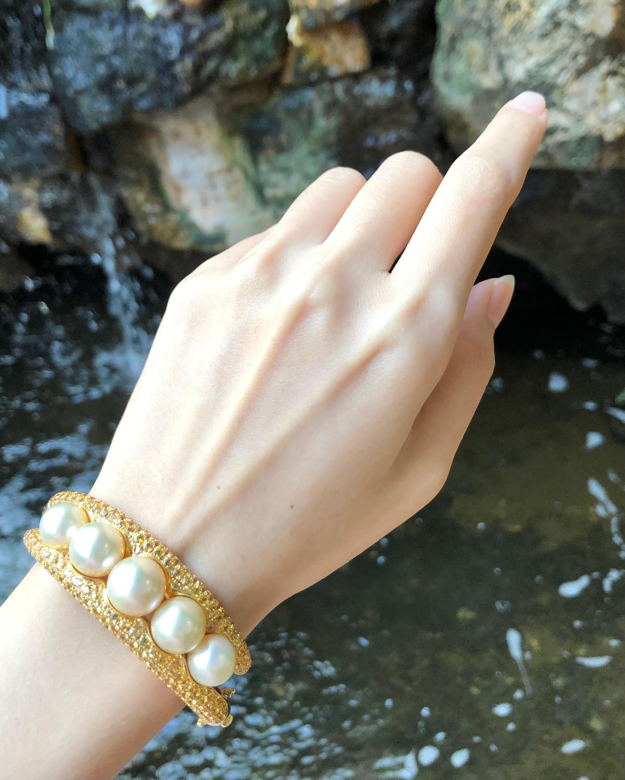 Women's Golden South Sea Pearl with Yellow Sapphire Bangle set in 18 Karat Gold For Sale