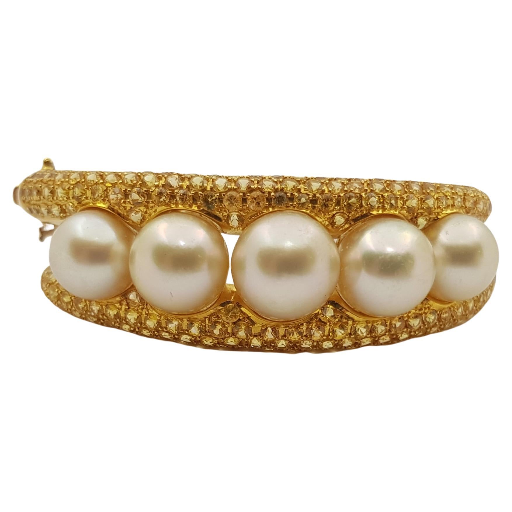 Golden South Sea Pearl with Yellow Sapphire Bangle set in 18 Karat Gold For Sale