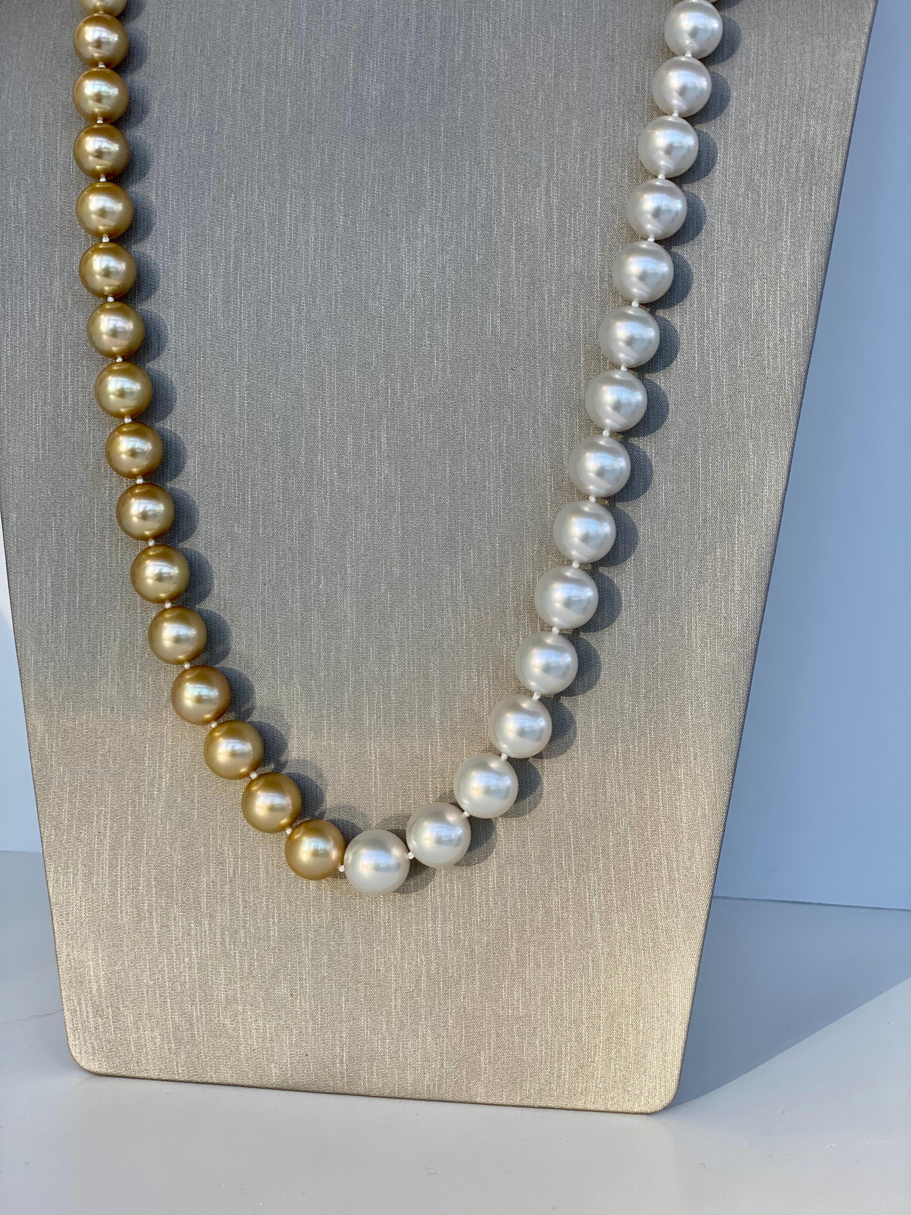 Golden And White South Sea Pearls. This Beautiful one of a kind strand of pearls features 31 Golden South Sea Pearls ranging in size from    mm to   mm and 32 Cream South Sea Pearls ranging in size from    mm too mm.   30 inches in length so can be
