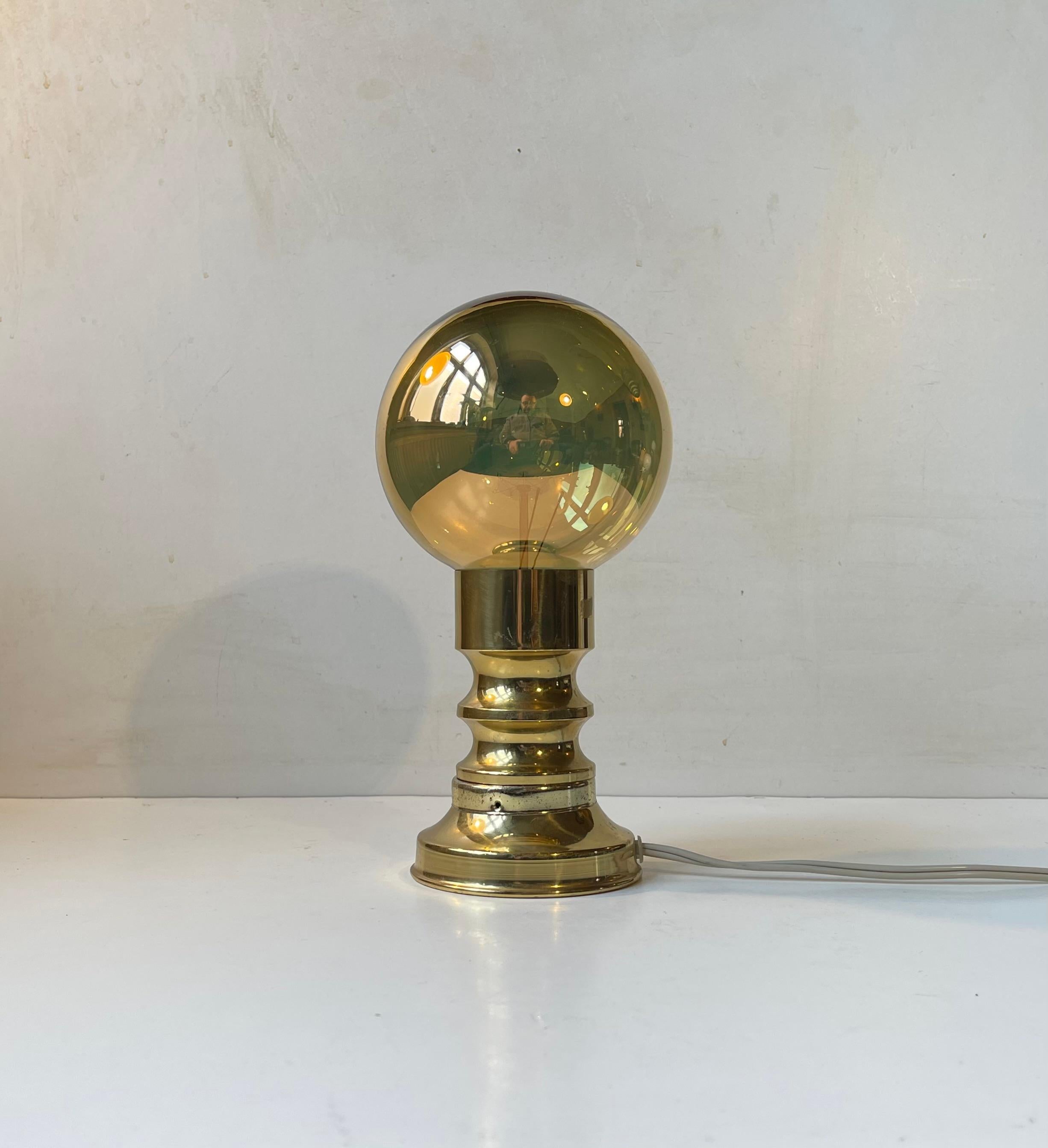 Frimann Table Light with original Golden everlasting Mirror/spy Bulb - E27 socket. Please notice that the light of this type of bulb is not meant to lid up the room but create a cosy, warm and ambient light. This table light features its original