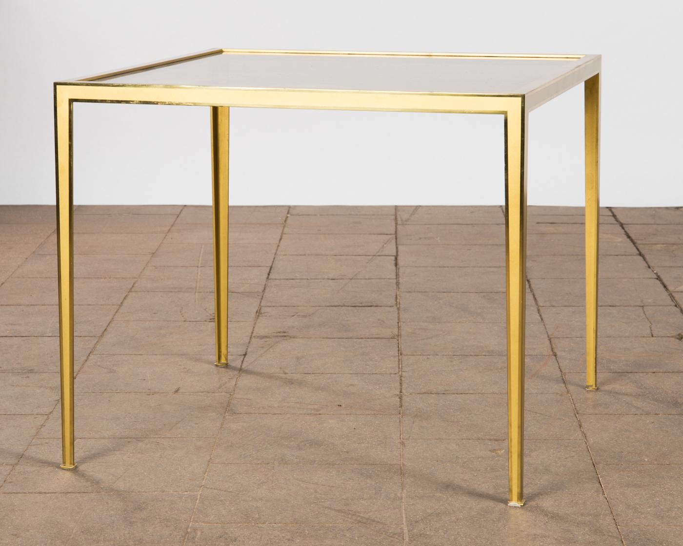Golden Mid-Century Modern square Brass coffee table by Vereinigte Werkstätten

Coffee or side table produced by German company Vereinigte Werkstätten München in the 1960s. The table is made of brushed messing, the top is made of smoked glass. Good