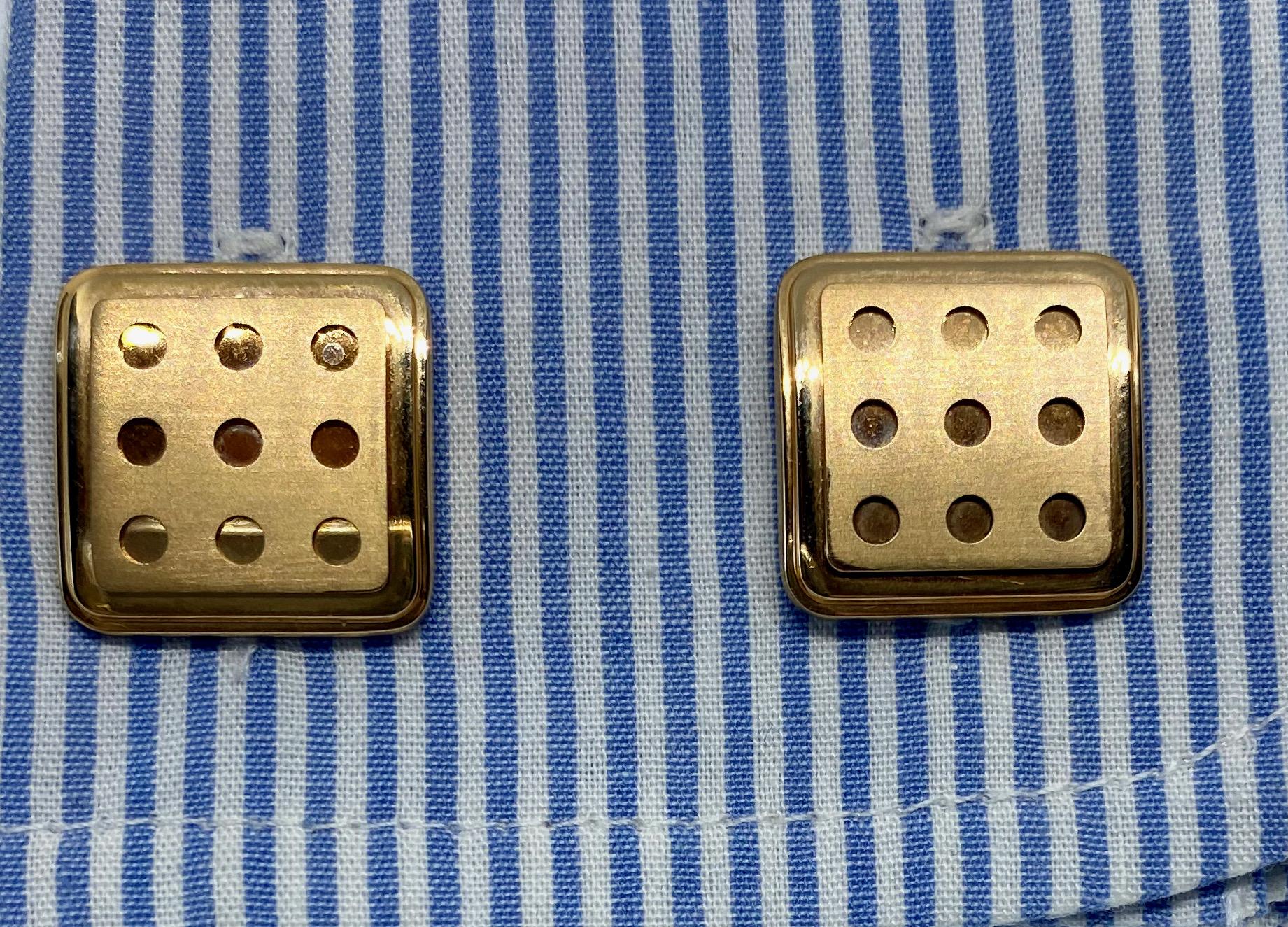 A striking and extremely rare pair of cufflinks in 18K rose gold made in Switzerland by Roger Dubuis. These cufflinks have square faces with brushed, perforated gold insets. The square toggle backs feature the RD logo.

Cufflink faces each measure