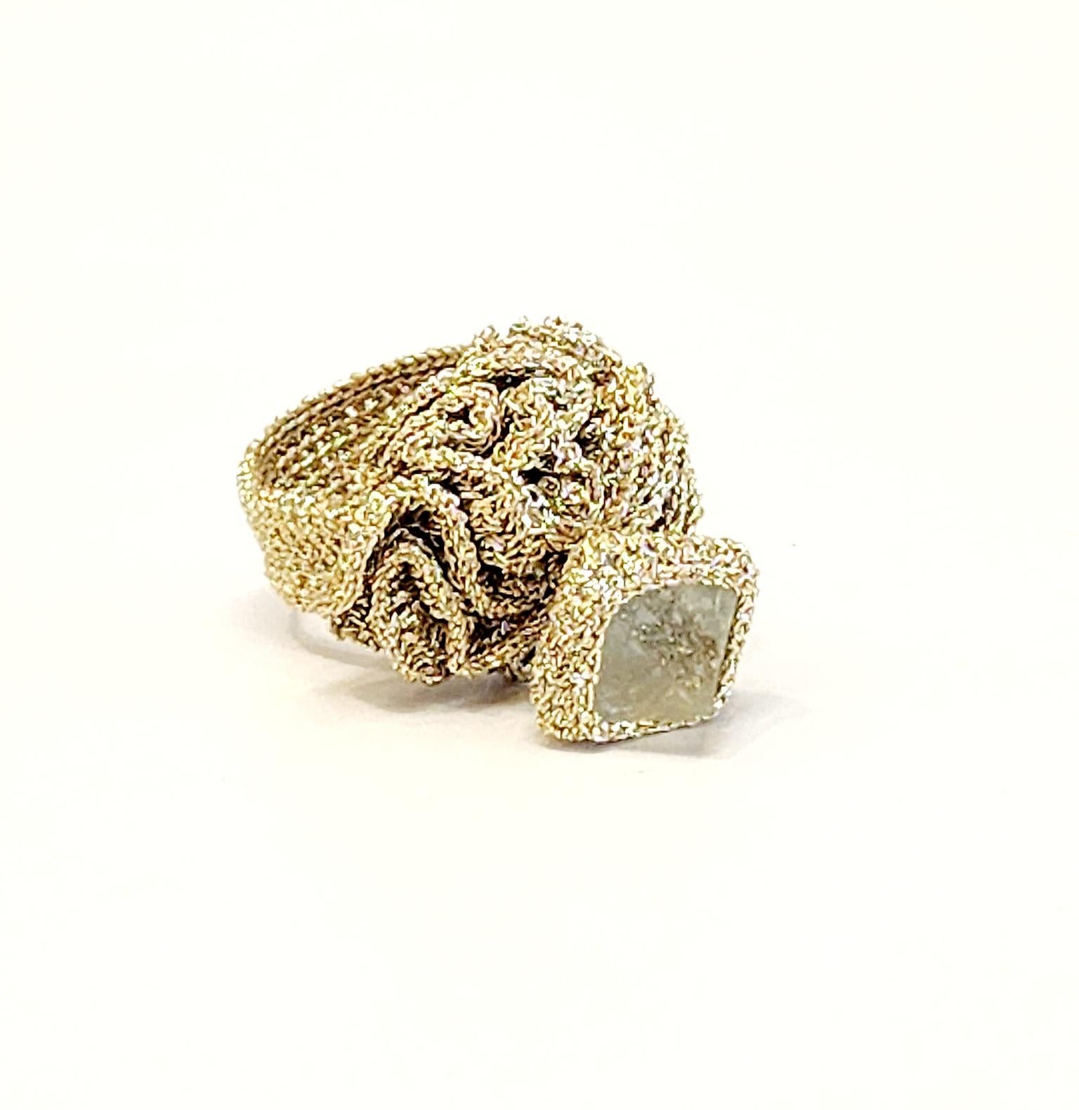 One of a kind handcrafted Crochet ring. This is a unique statement Cocktail ring. A beautiful Pyramid shaped aqua Fluorite Stone Crochet on top of a wavelike round design. The ring is very light as it is Crochet with Golden smooth passing Thread