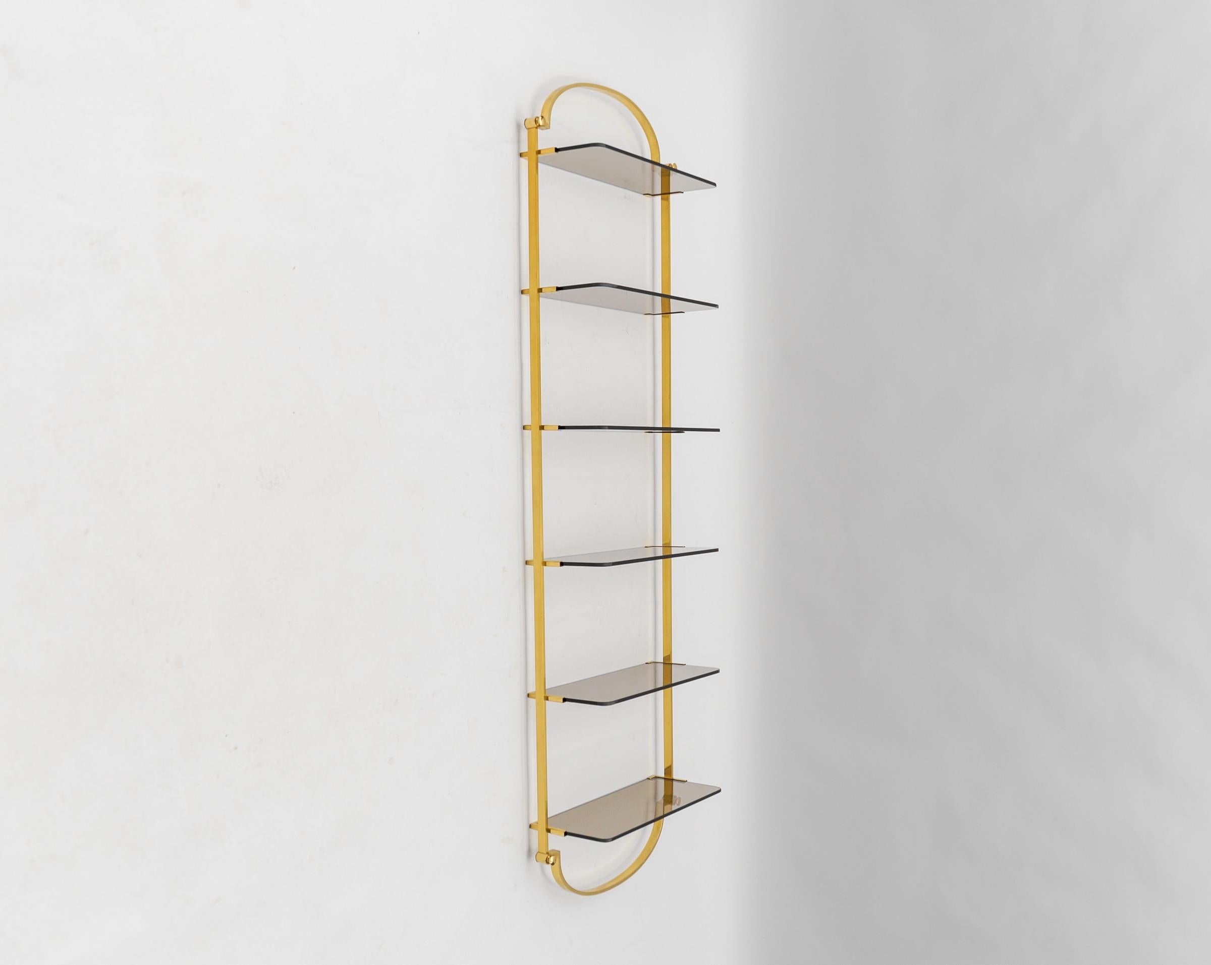 Hollywood Regency Golden wall shelf with six smoked glass shelves, Italy, 1960s For Sale